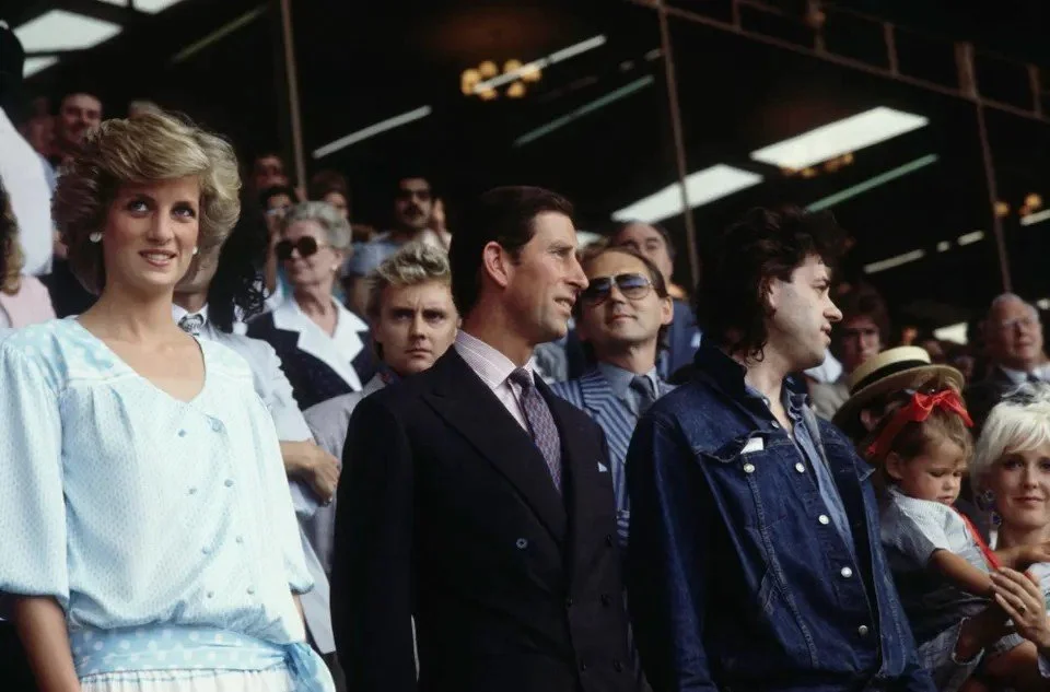 Bob Geldof (R) with Princess Di and Charles