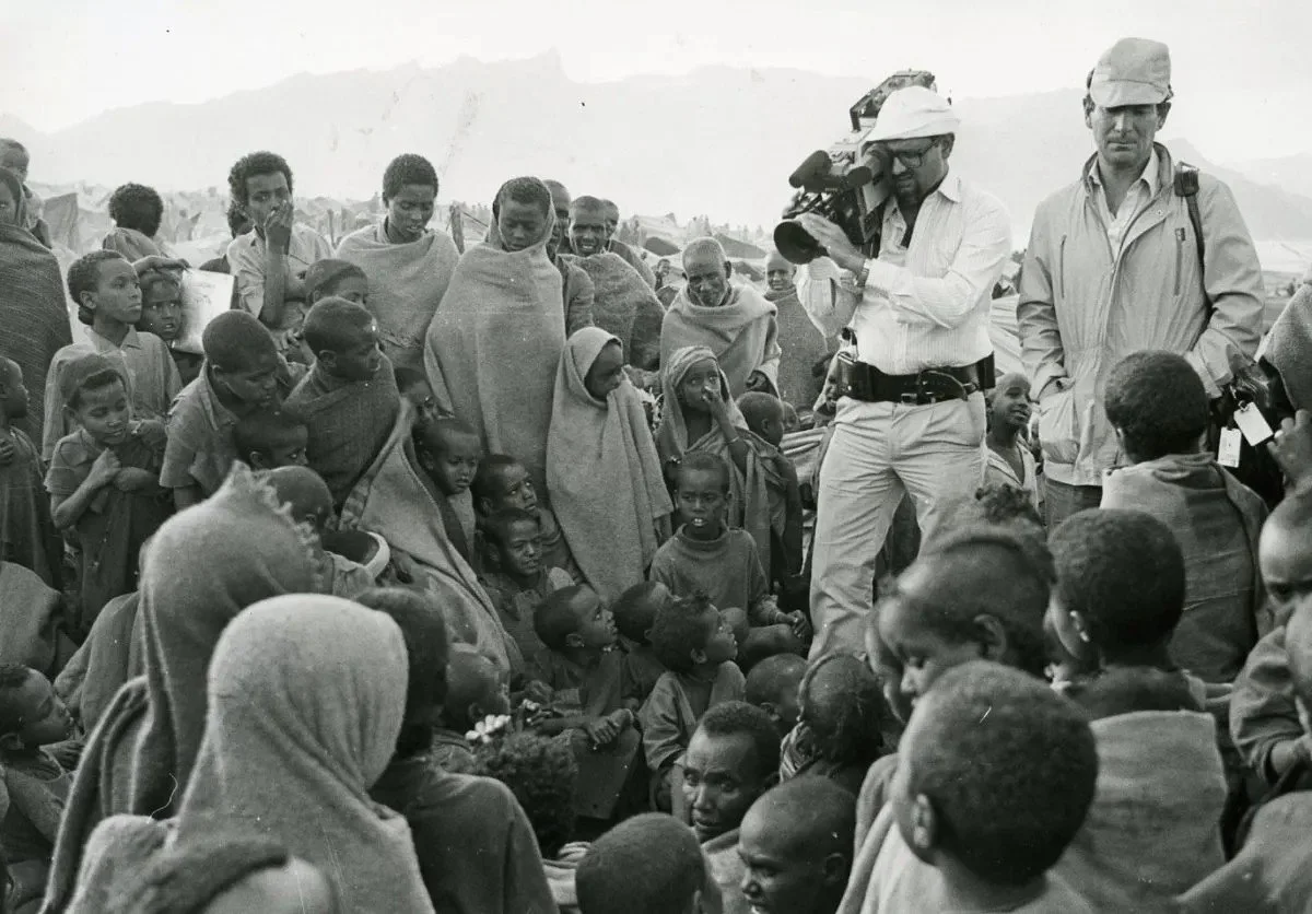 BBC reporter and cameraman documenting the famine