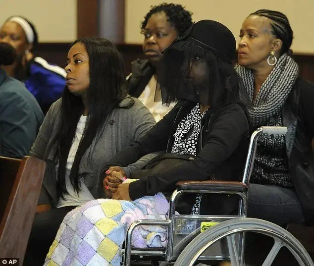 Faith-Harris-Green in wheelchair and veil during probable cause hearing