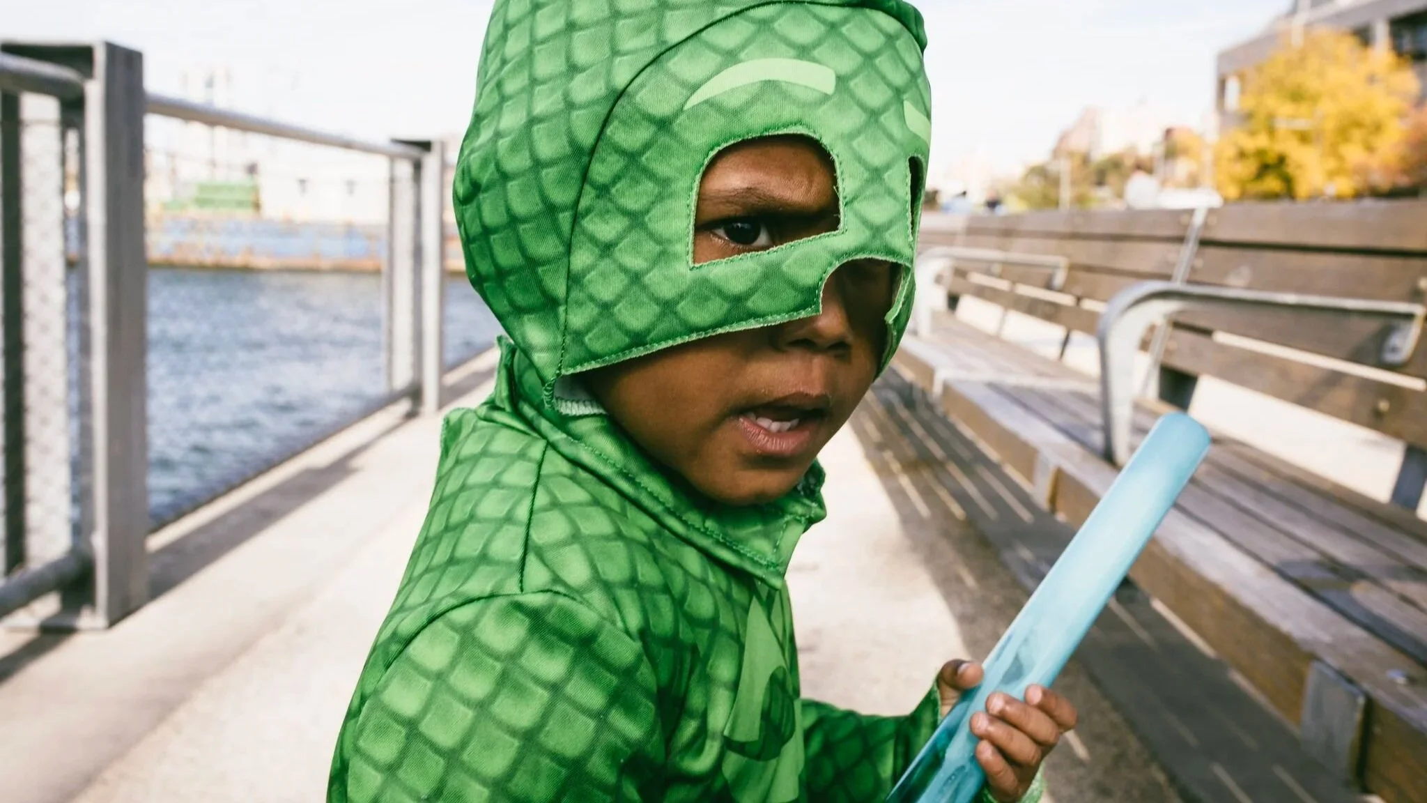 Young Black boy in superhero Halloween costume — documentary portrait by Black Shutter Productions