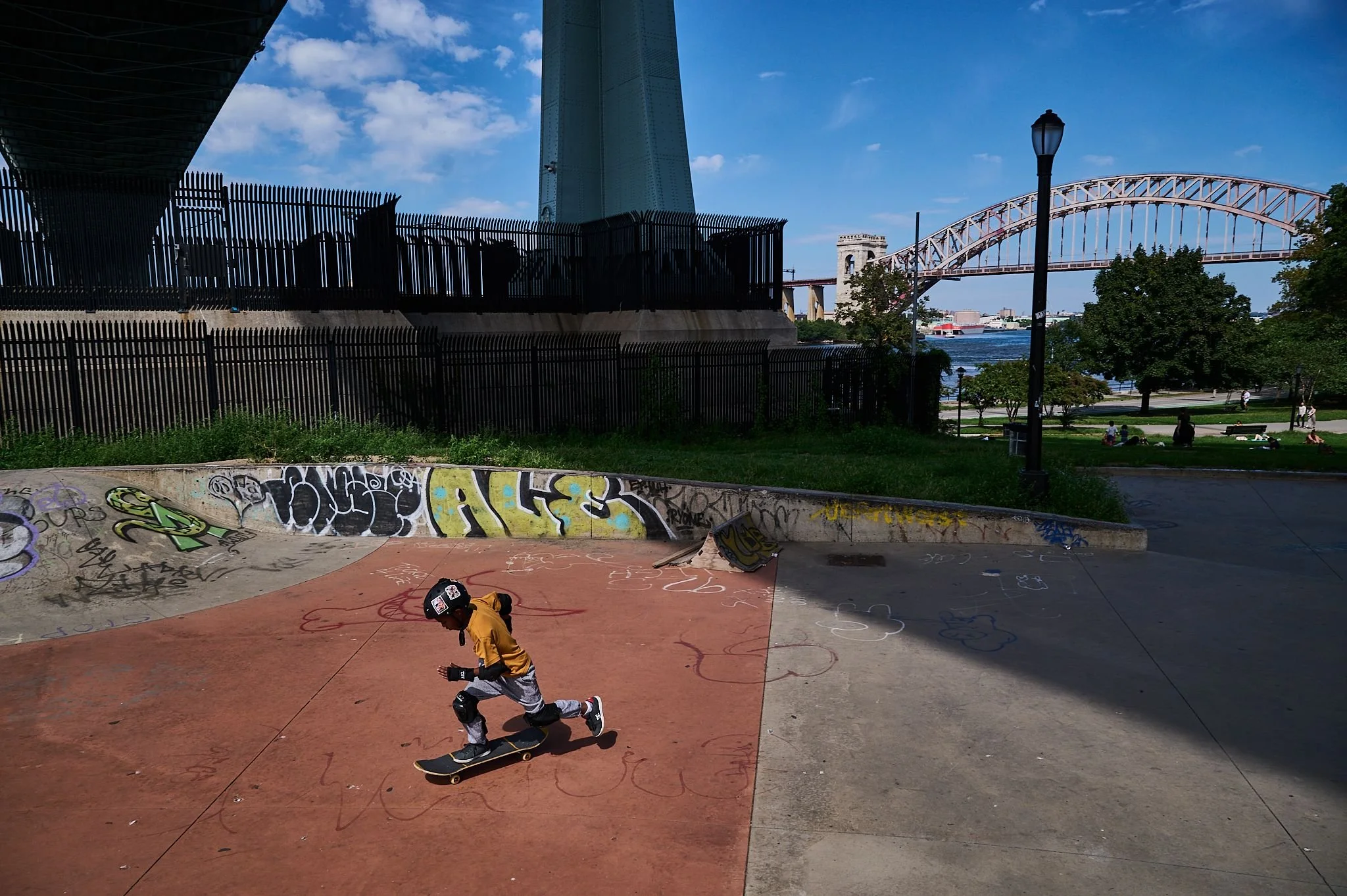 Young Black boy skateboarding at New York City skatepark — documentary photography by Black Shutter Productions