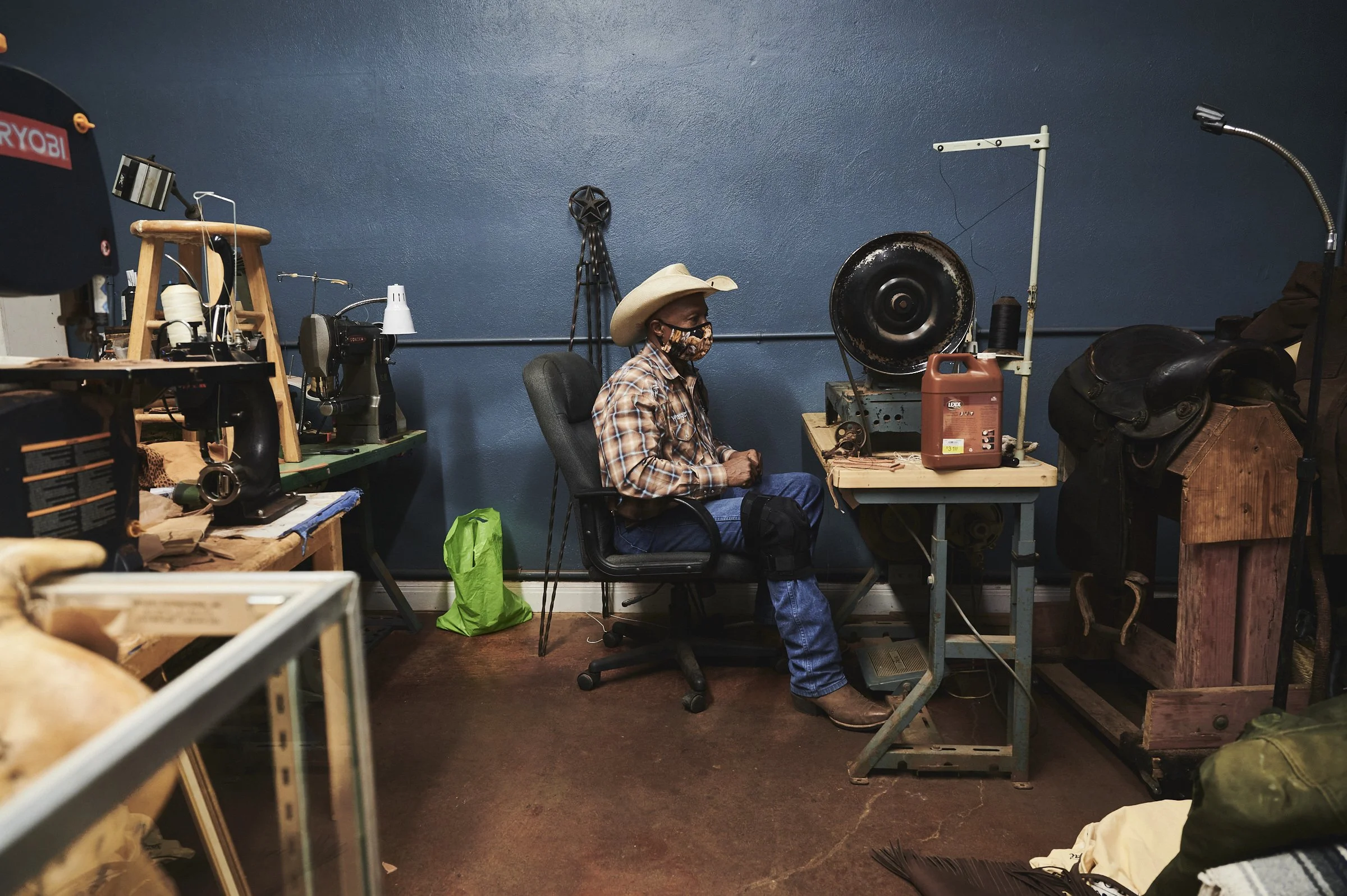 Larry Callies, founder of the Black Cowboy Museum, at his leatherworking desk in Rosenberg Texas — documentary portrait by Black Shutter Productions