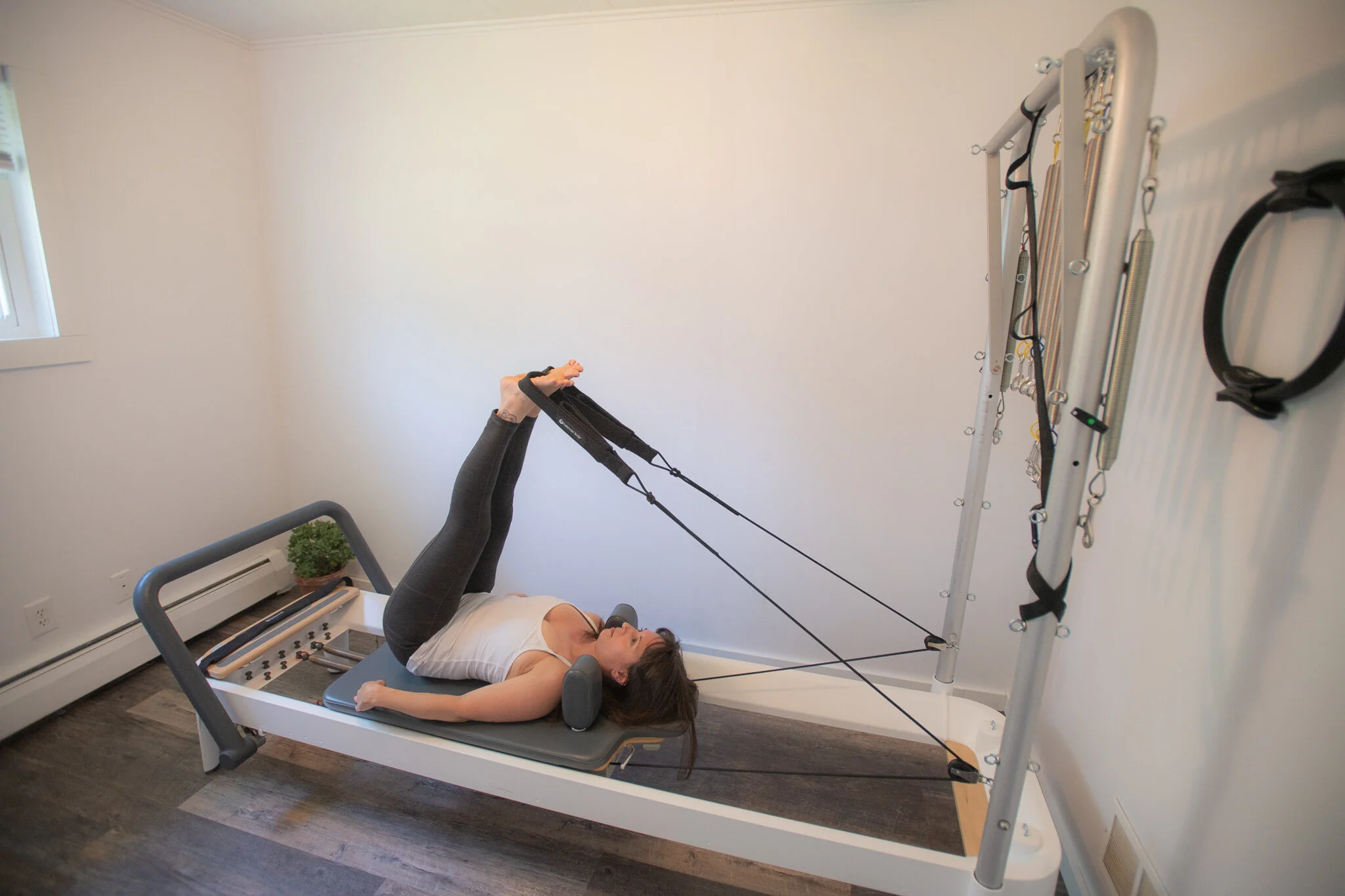 Pilates in Frankfort, MI on the reformer Short Spine phase 1