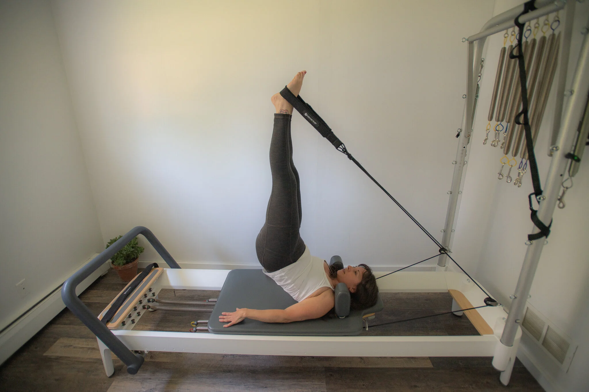 Pilates in Frankfort, MI on the reformer Short Spine phase 3