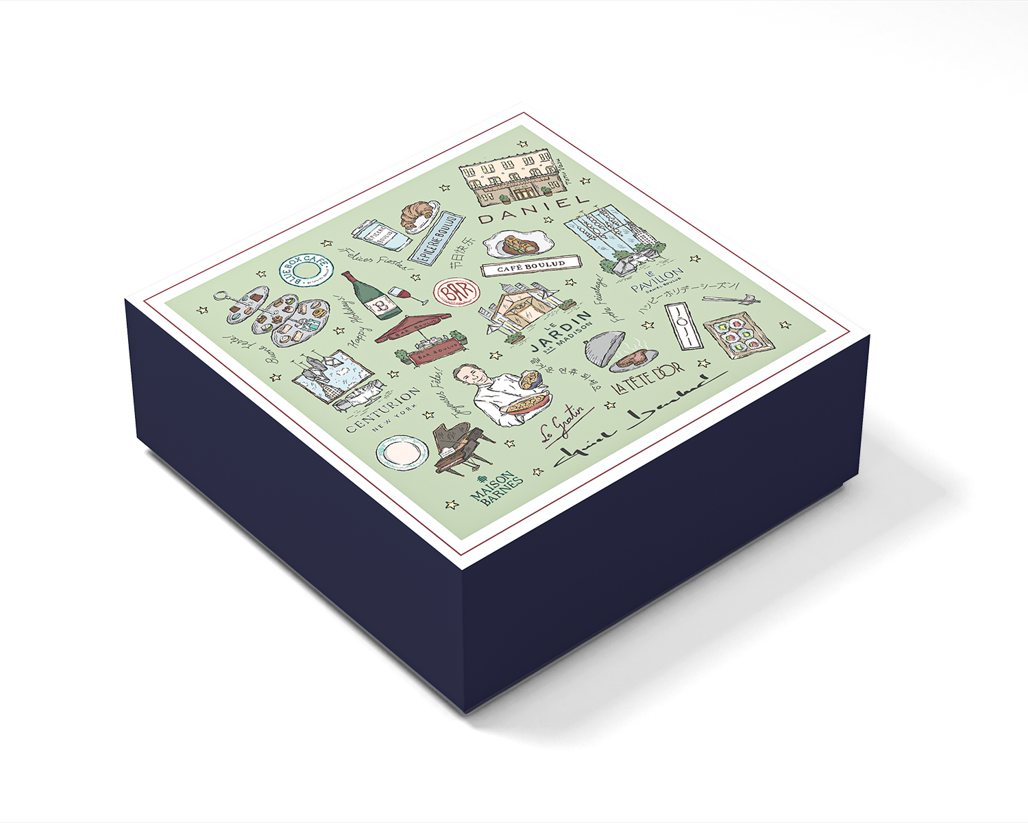 A box designed by Tanu Vasu for David Baloud with illustrations of Paris-themed landmarks, food, and cultural icons, including the Eiffel Tower, a baguette, oysters, and a chef, with handwritten labels and signatures.