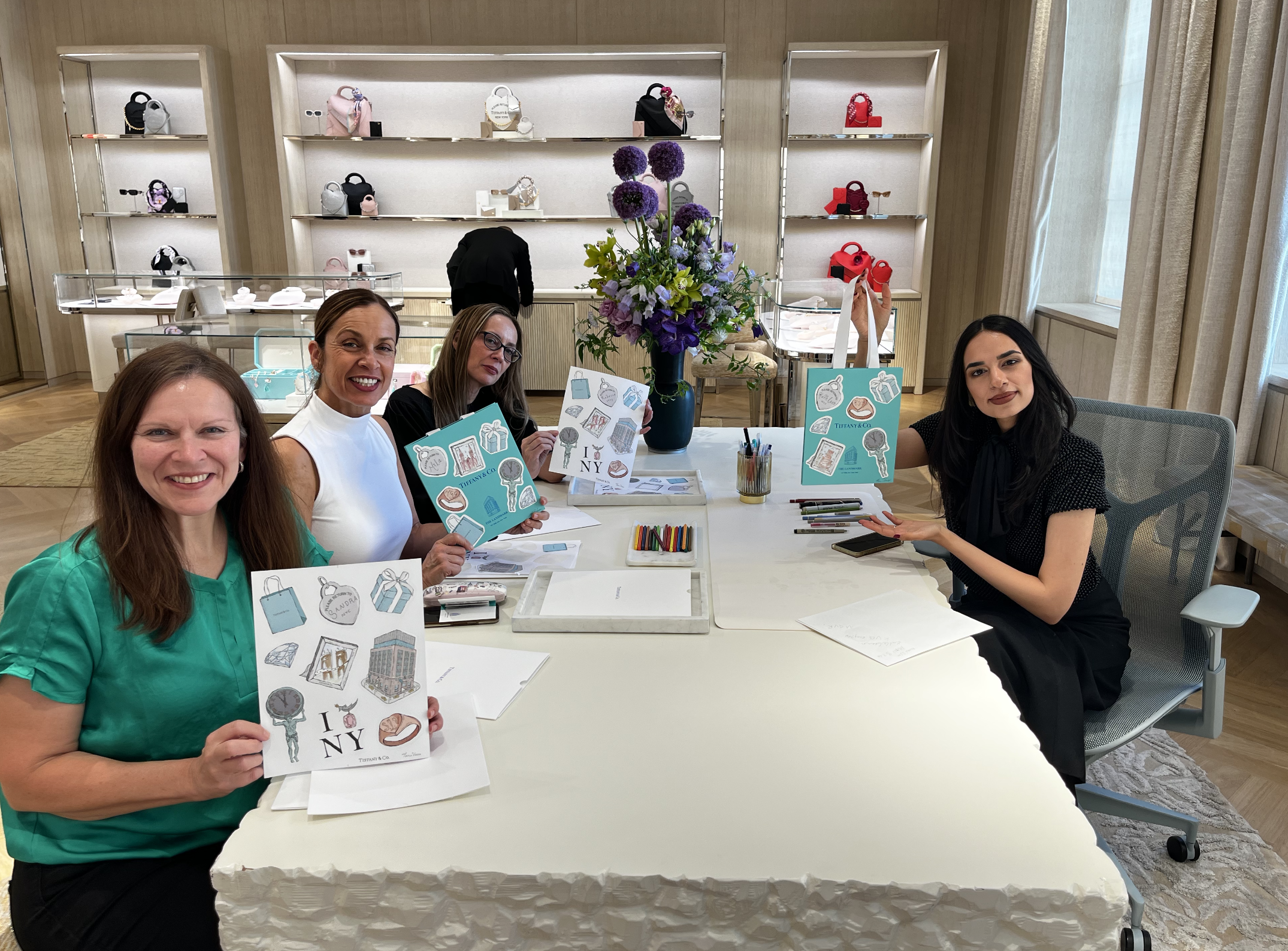 Tanu Vasu creating a live custom artwork performance for an audience at Tiffany & Co.