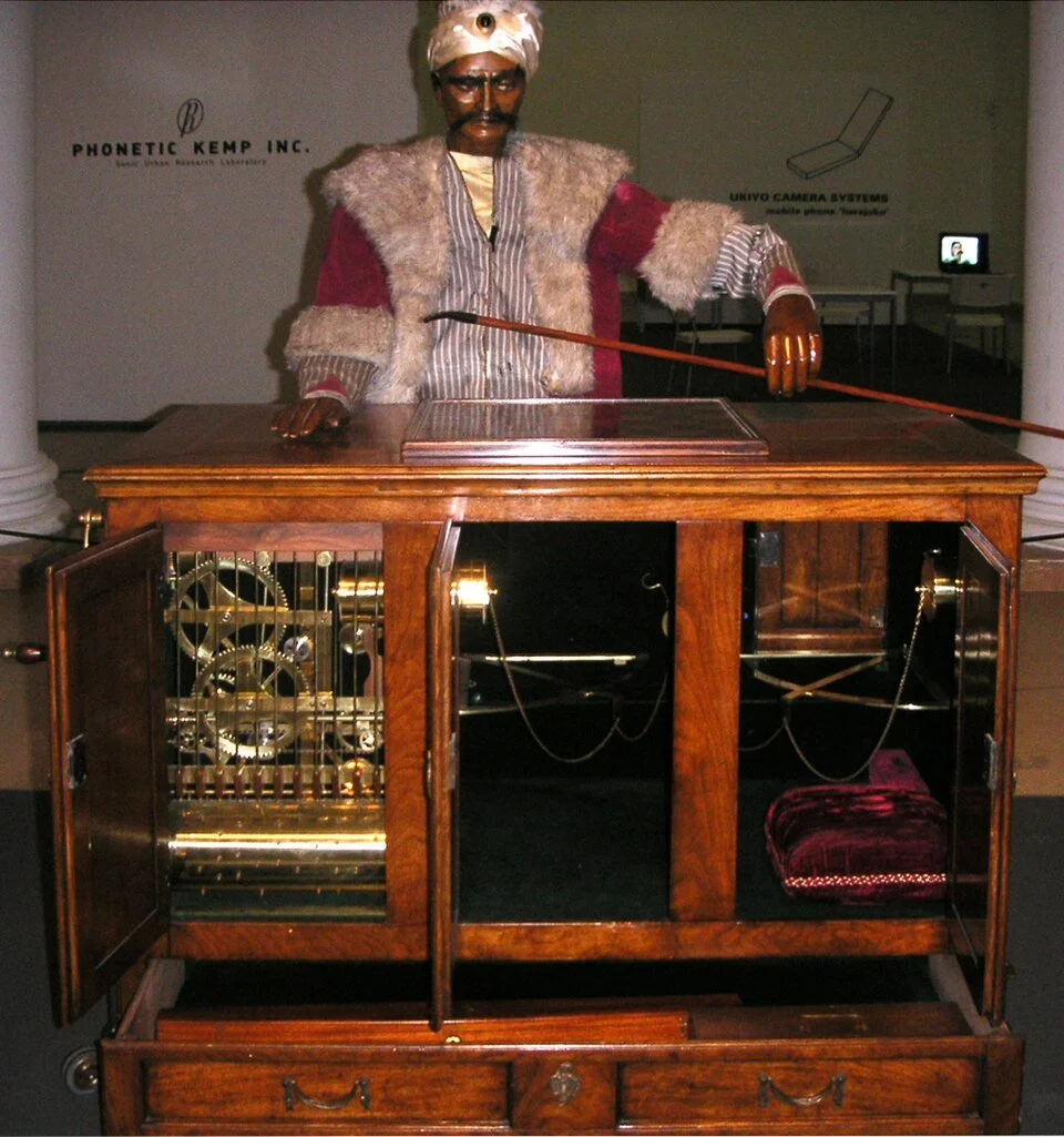A photograph showing a replica of the Mechanical Turk