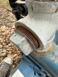 Photograph of a rusted pipe cap