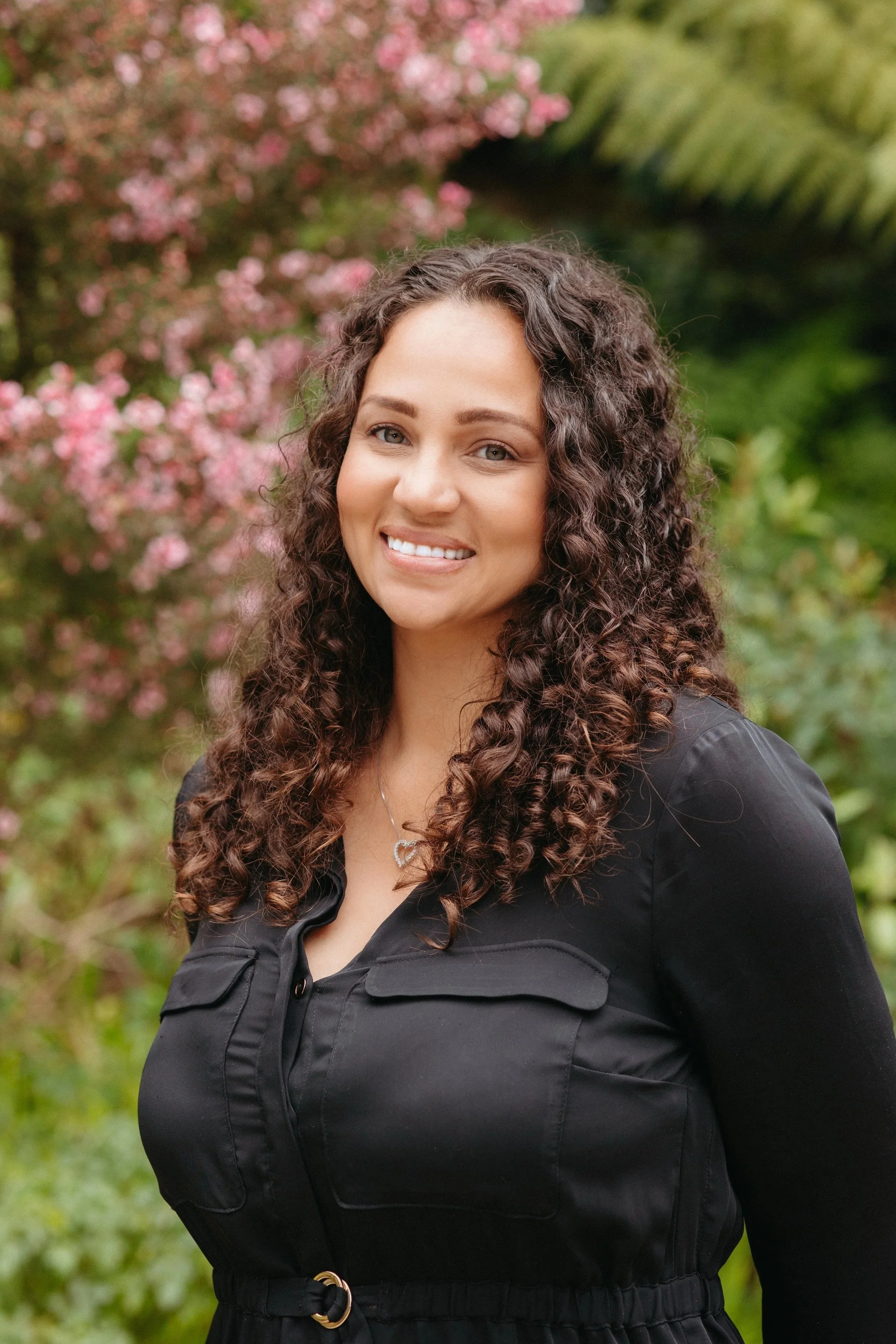 Angelique headshot in a black shirt