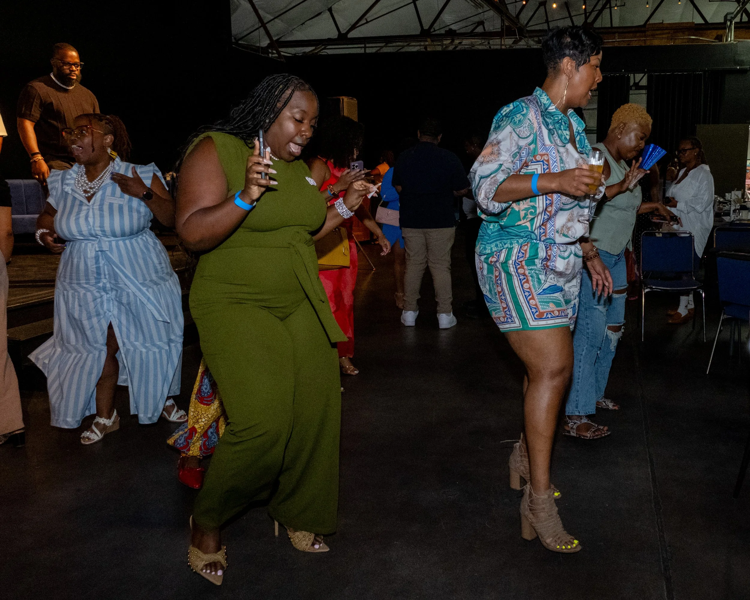 Attendees dance together during the event.