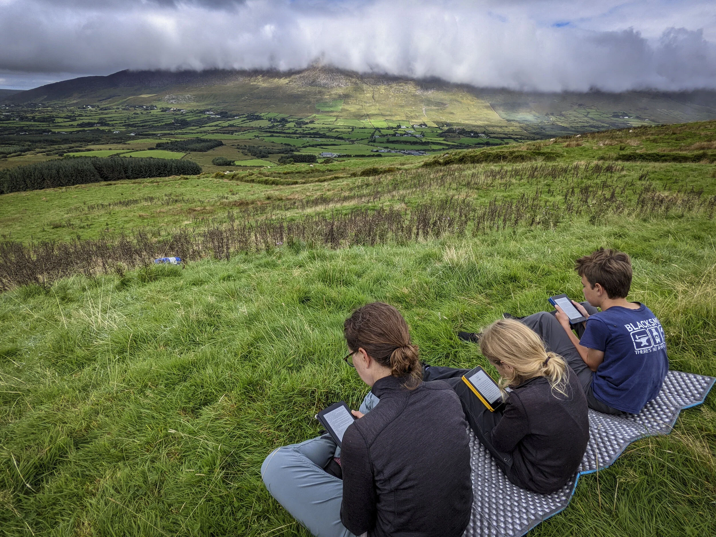WTH guys! We schlepped ourselves all the way up here for the stellar views and you pull out your Kindle? Irish pearls, meet my swine.