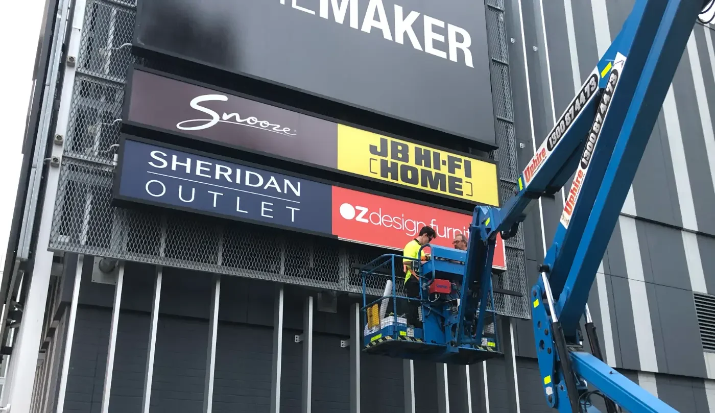 Homemaker outdoor signage being installed