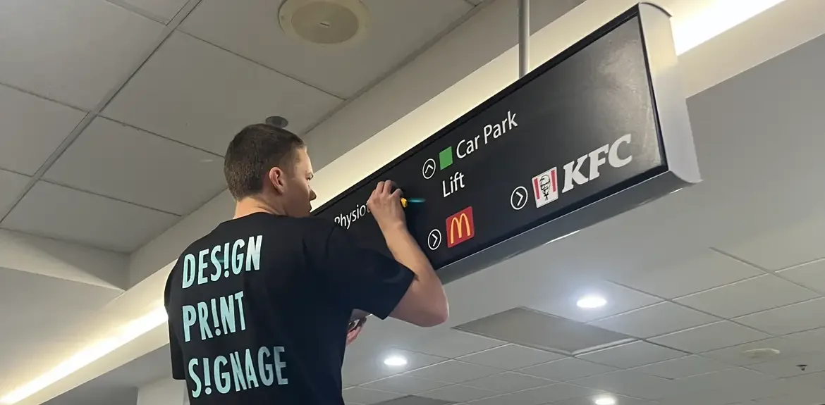 Wayfinder signage being installed in shopping centre