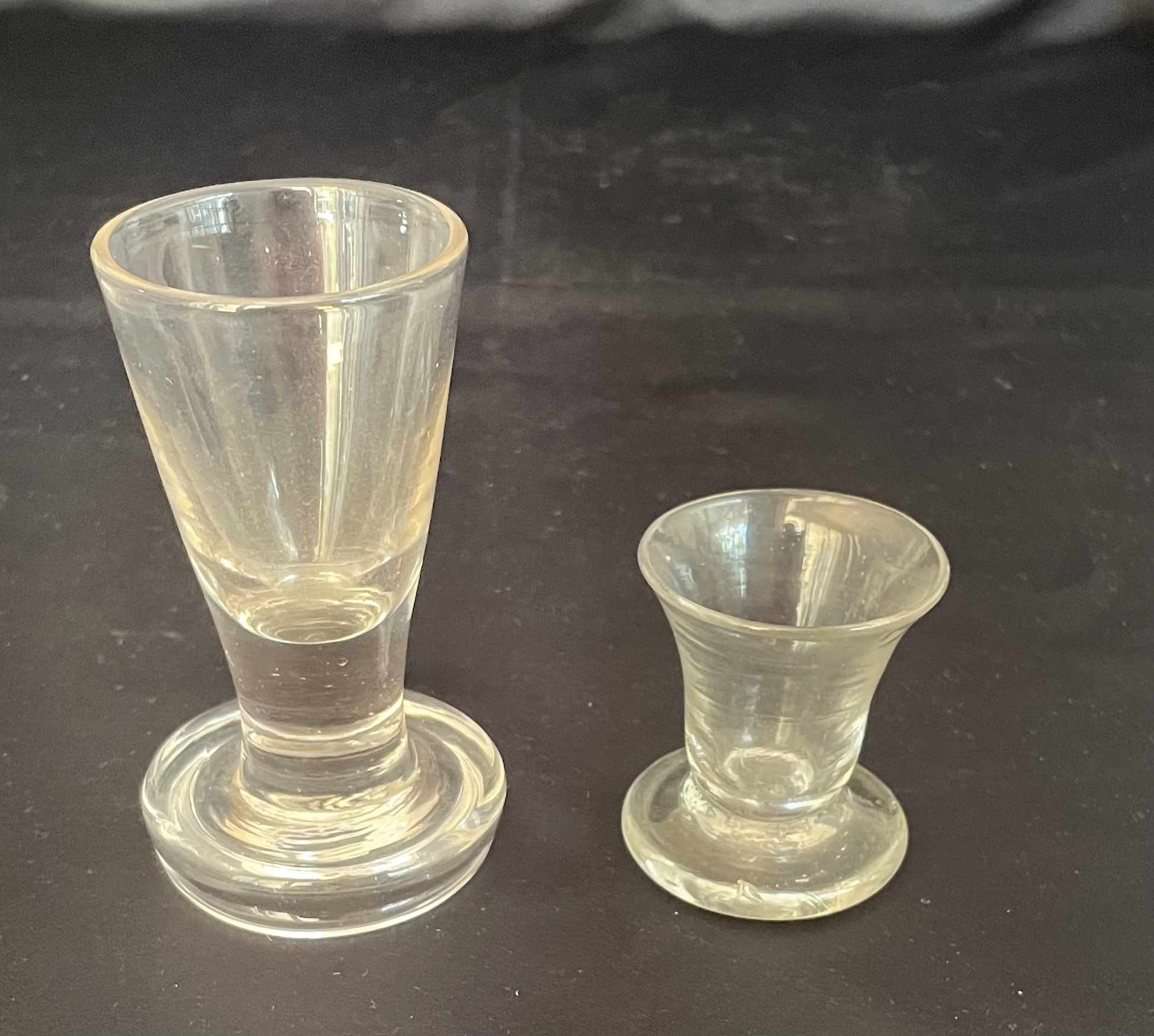 A Pair of 1760's Firing Glasses: One with a Tapering Bowl the other with a Bell Bowl both on Circular Base