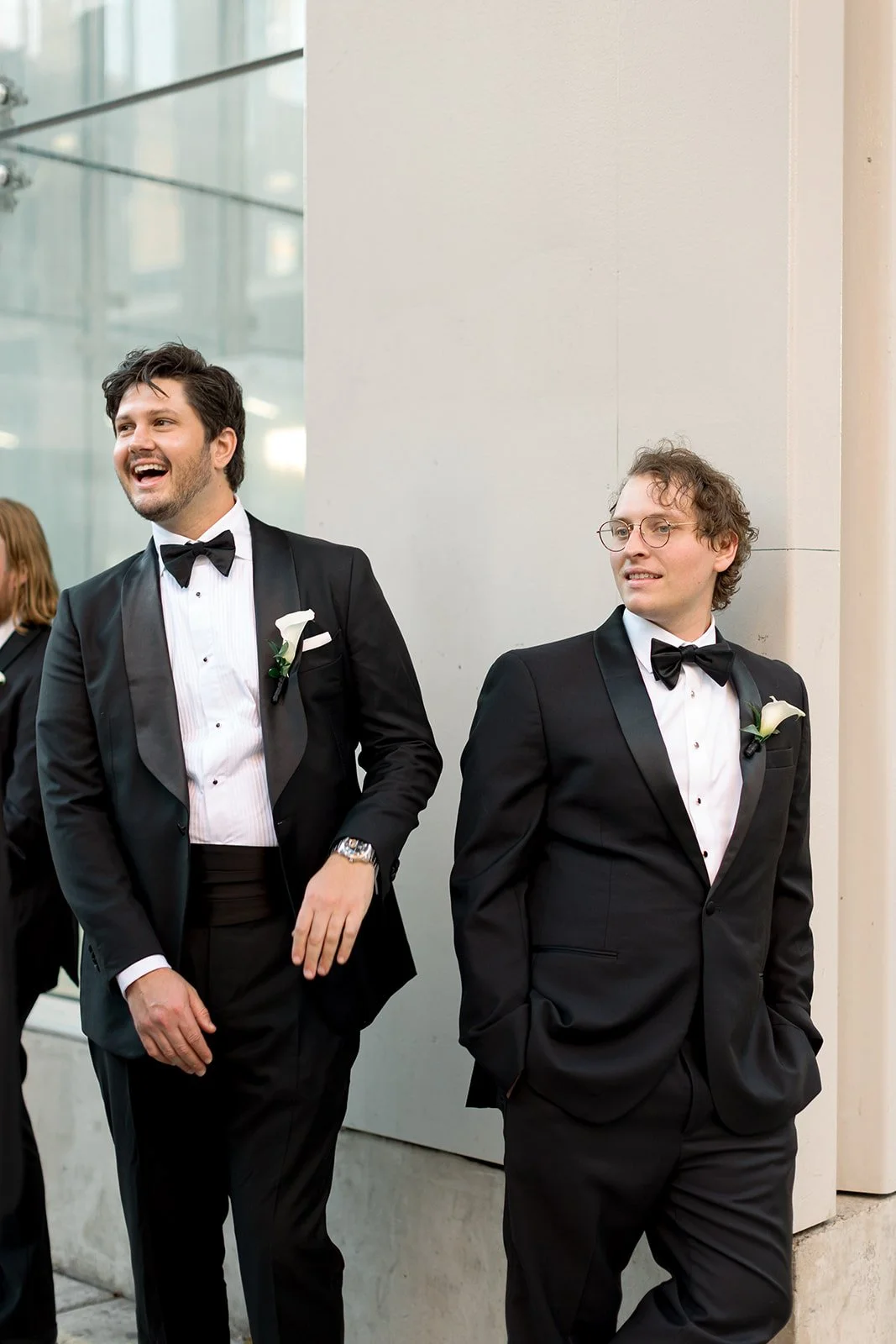 the groom with his groomsmen hanging out outside