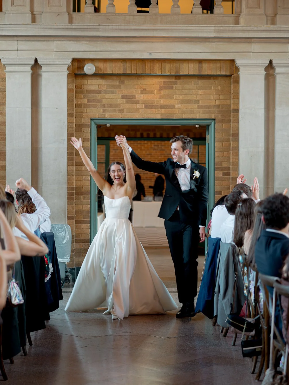 chicago-wedding-photographer-reception-grand-entrance-arms-raised-02.jpg