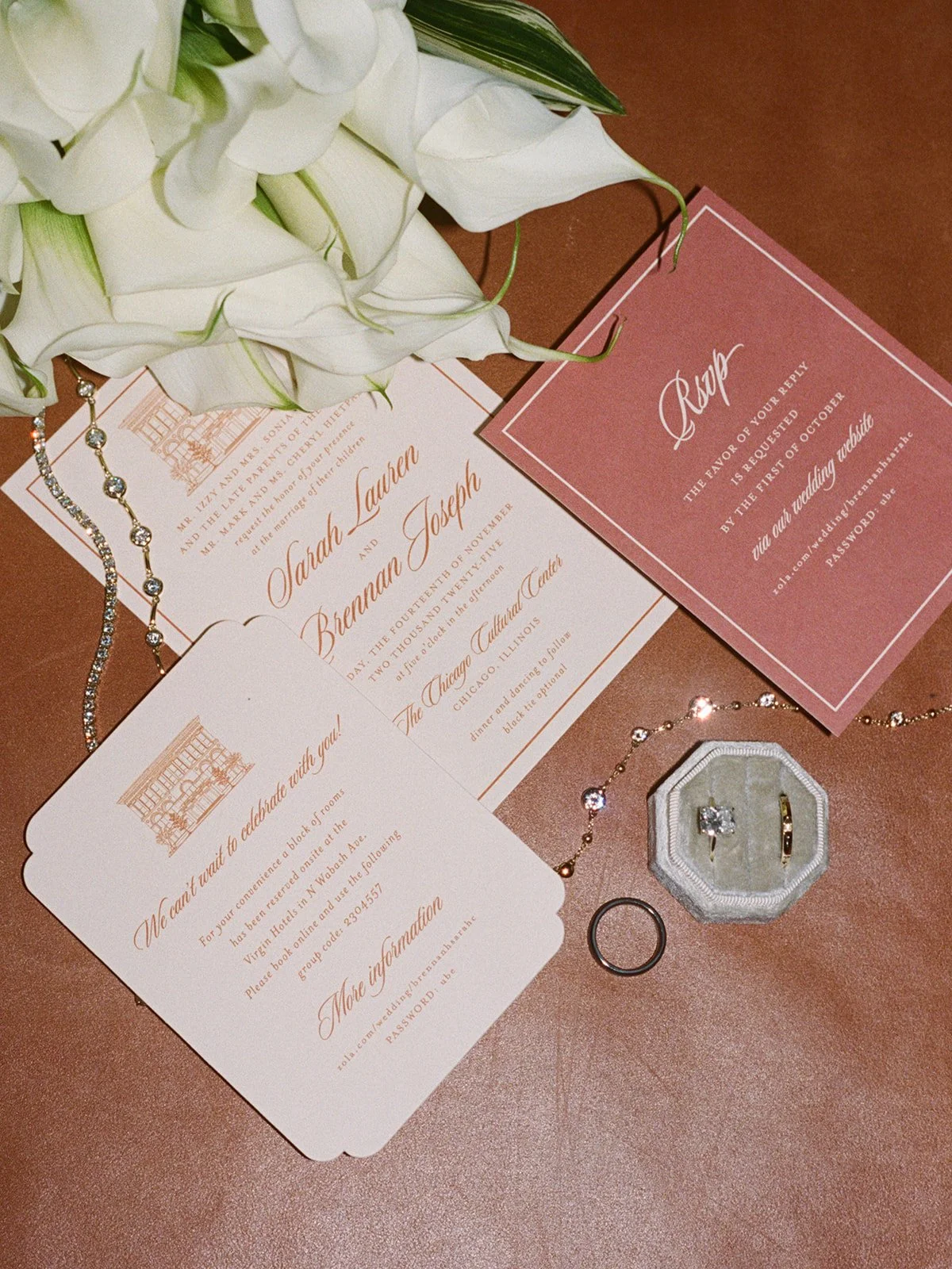 The wedding invitation suite featuring elegant stationery with the couple's names Sarah and Brennan. Shot on film by a Chicago wedding photographer.