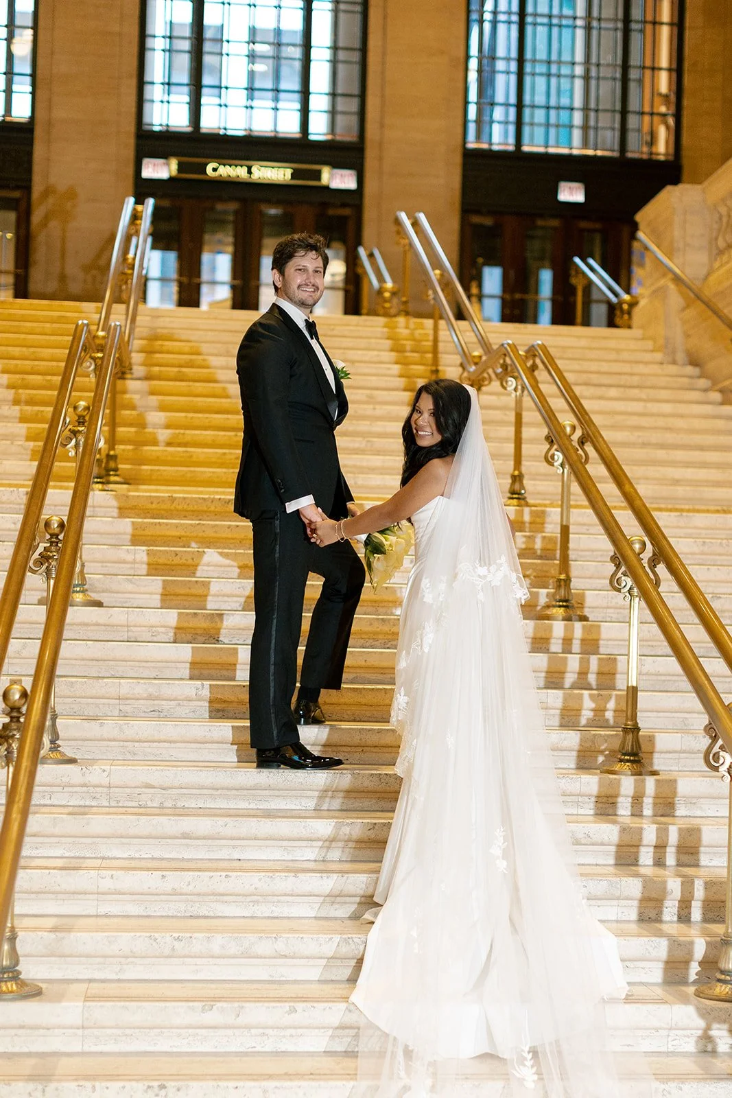 Sarah and Brennan share a romantic portrait moment on Union Station's ornate grand staircase. Shot on film by a Chicago film wedding photographer.