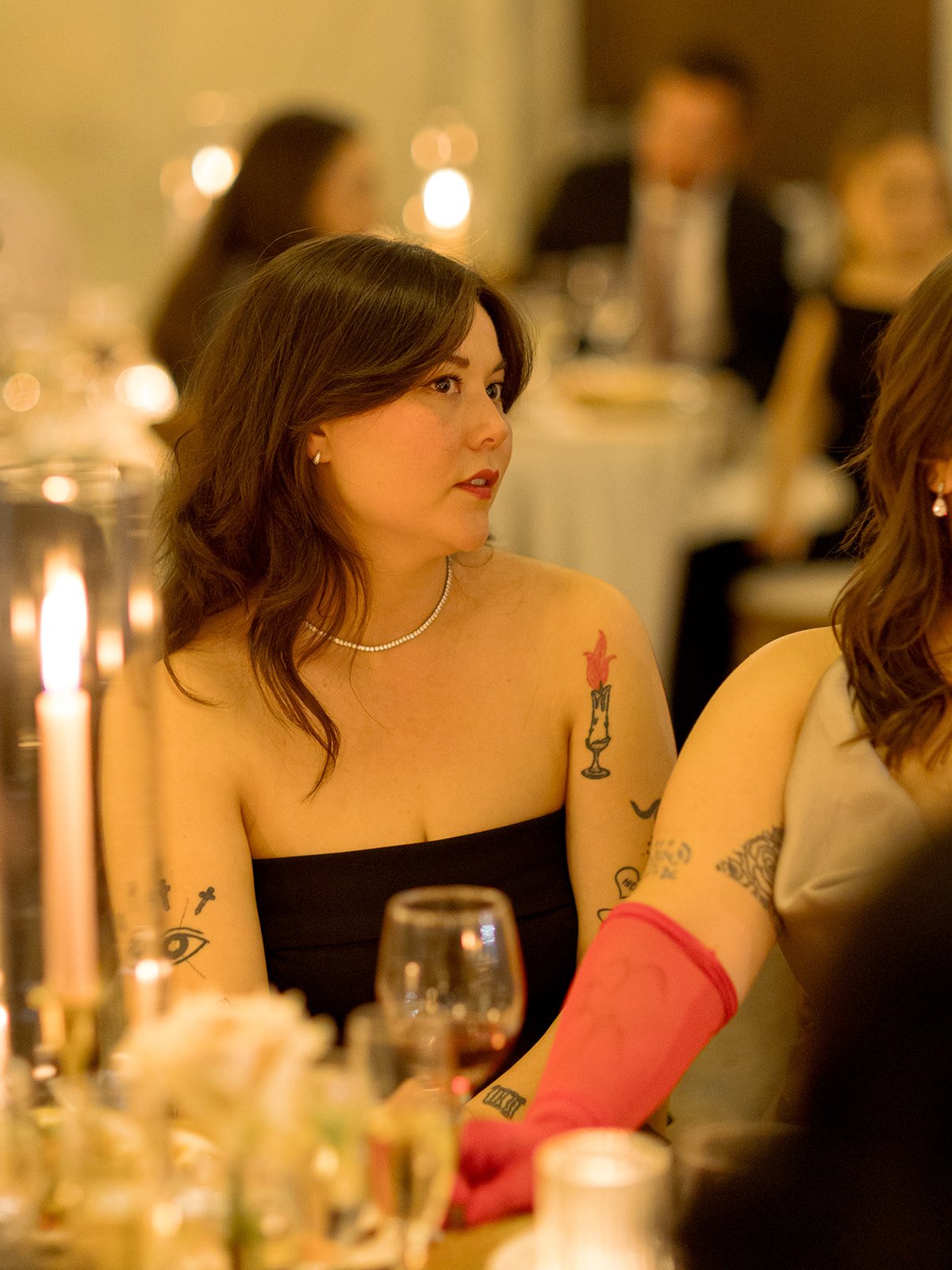 A wedding guest savoring their dinner course at a beautifully set table during the reception. Shot on film by a Chicago wedding photographer.