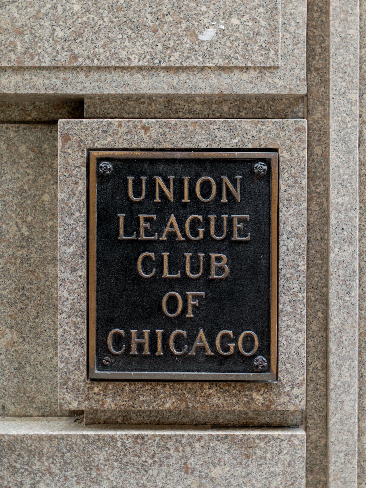The Union League Club of Chicago’s iconic bronze entrance plaque mounted on a stone facade — the first frame of a day as distinguished as its address.