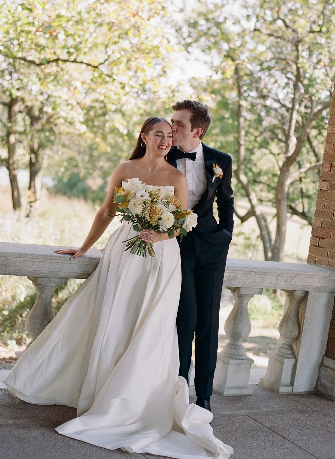 chicago-film-wedding-photographer-couple-groom-whisper-kiss-balustrade-11.jpg
