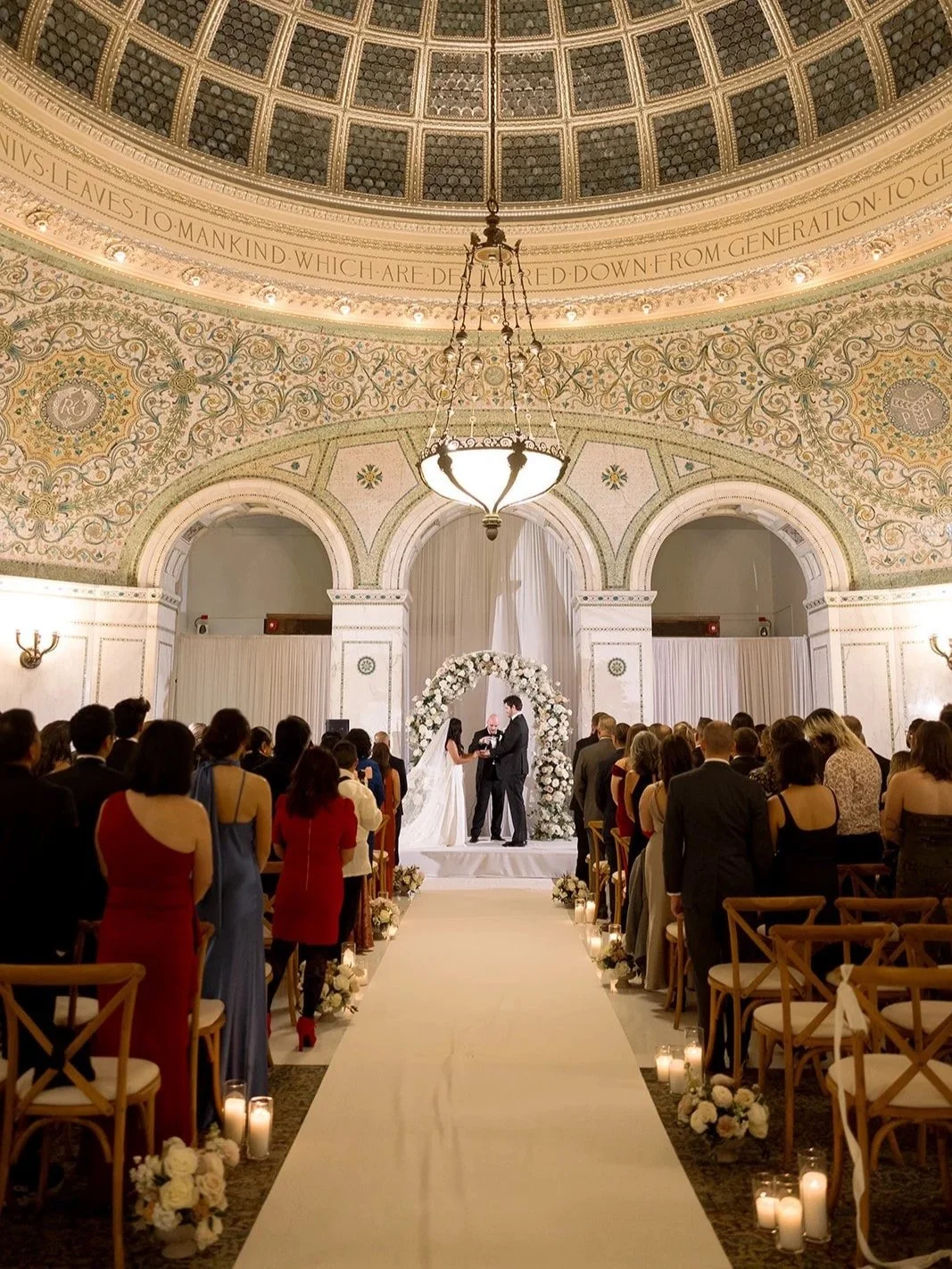 sarah and brennan on the altar during the ceremony holding hands