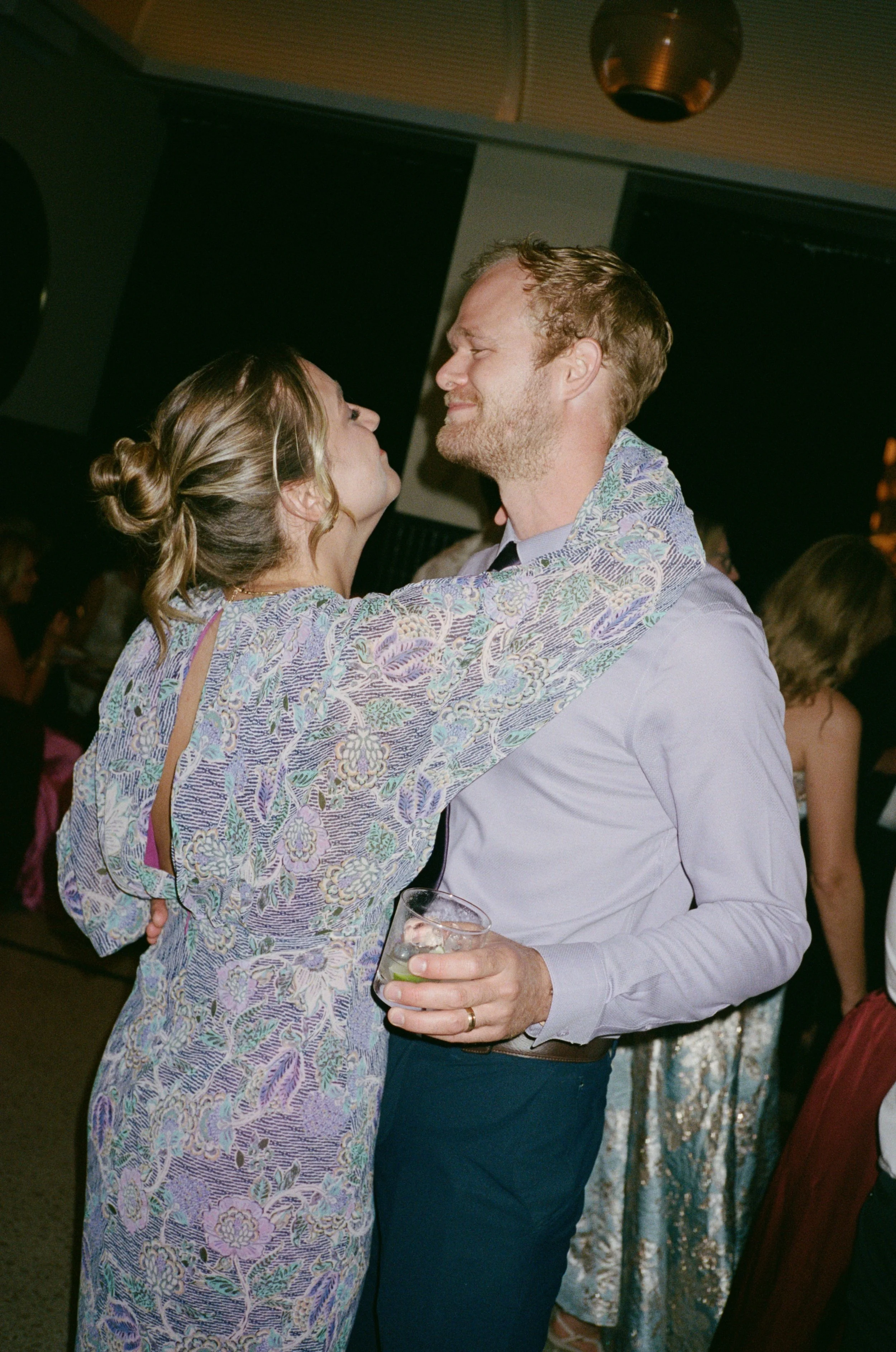 Guests share a close slow dance moment on the reception dance floor