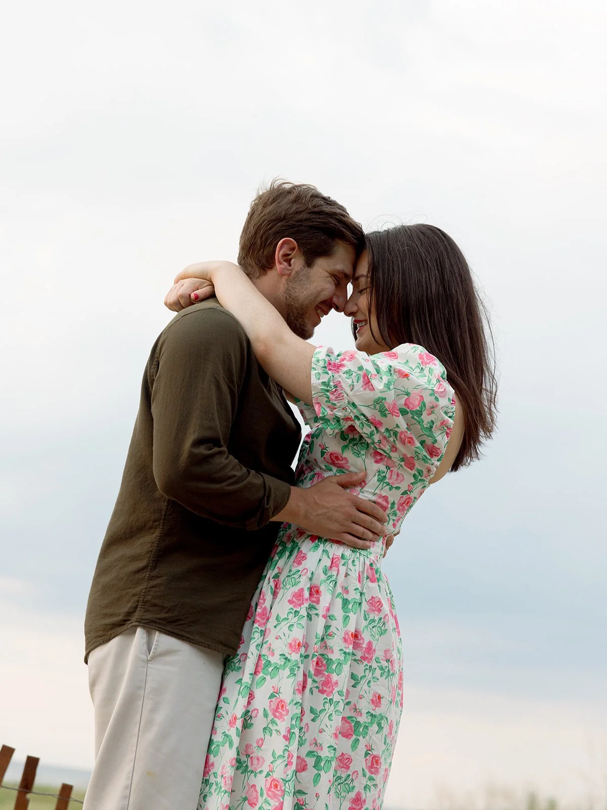 a couple holding each other on lake michigan