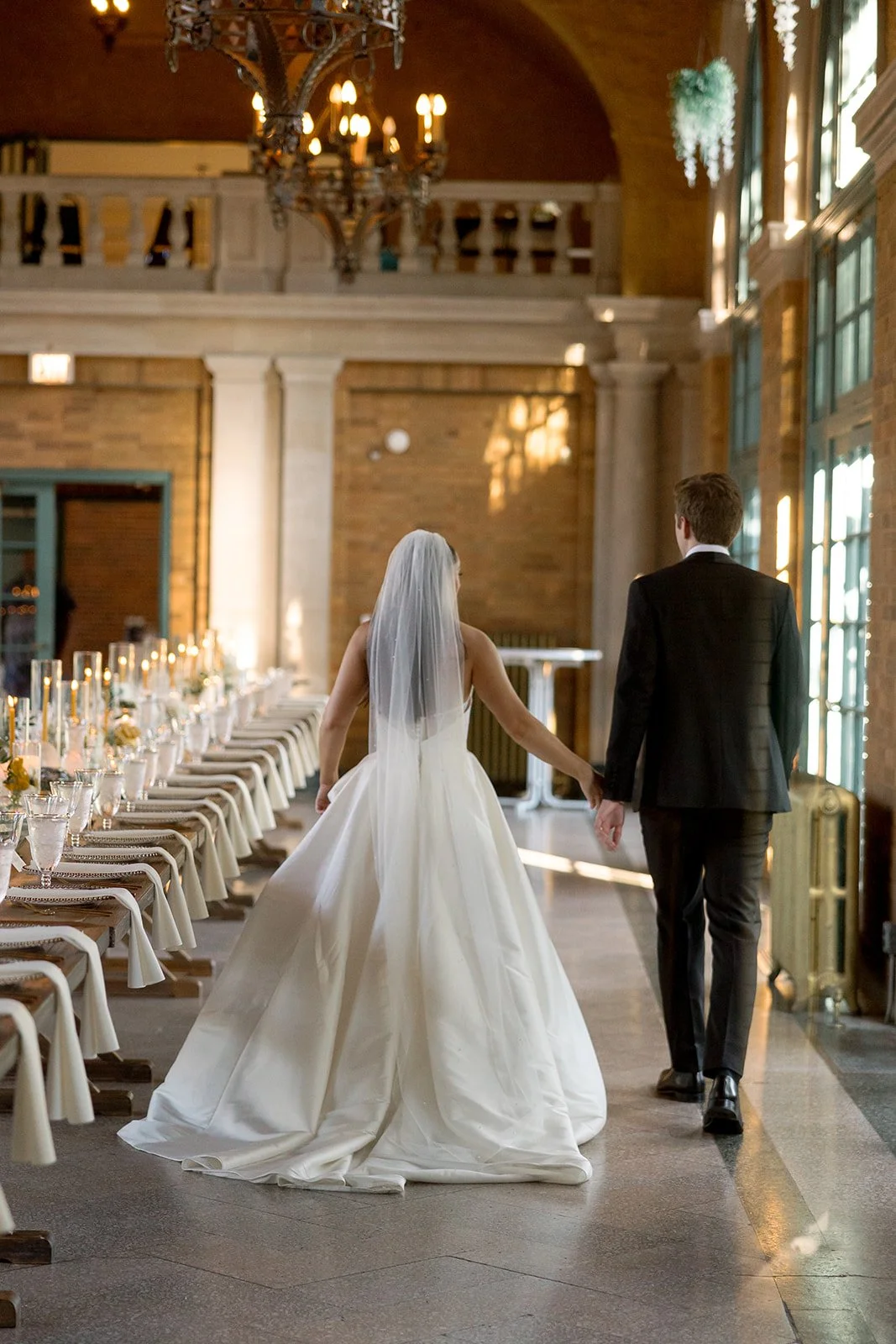chicago-wedding-photographer-just-married-walking-into-reception-hall-09.jpg
