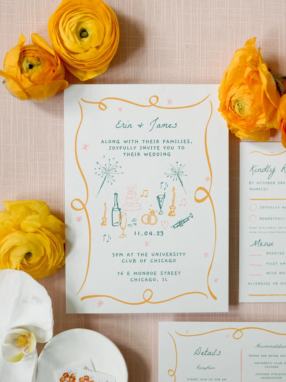 The wedding invitation suite flat lay — Erin & James's illustrated, hand-lettered invite with playful champagne, trumpet, and ring motifs, the University Club Chicago address printed boldly at center, surrounded by yellow ranunculus.
