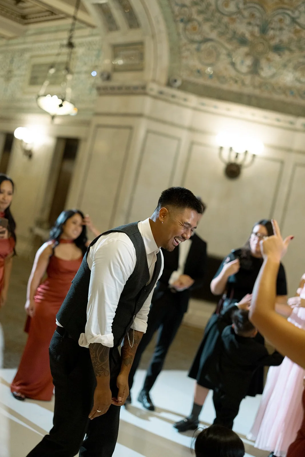 Guests on the dance floor during the reception at Chicago Cultural Center