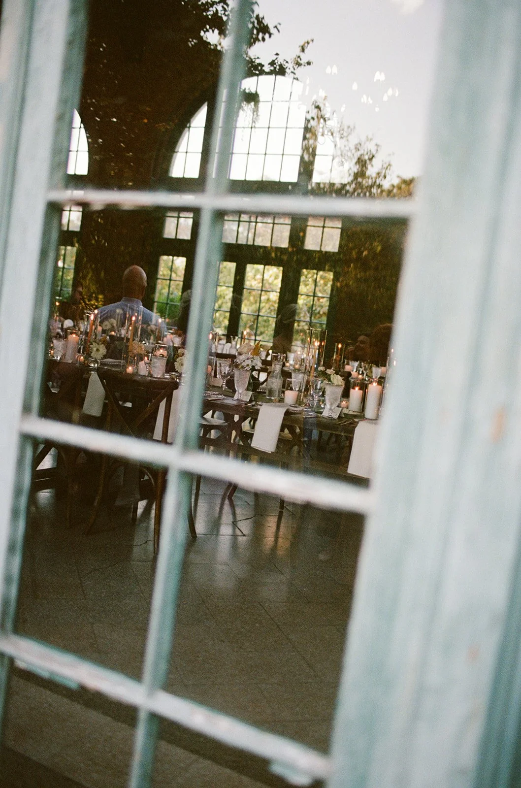 chicago-film-wedding-photographer-reception-through-teal-window-36.jpg