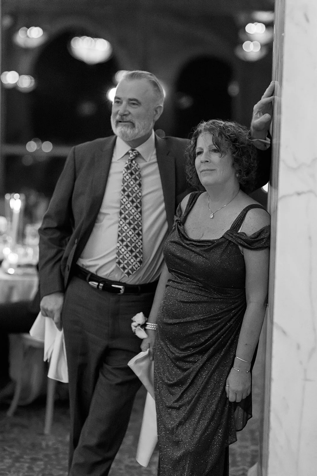 A black and white photo of guests listening in on toasts at the Chicago Cultural Center