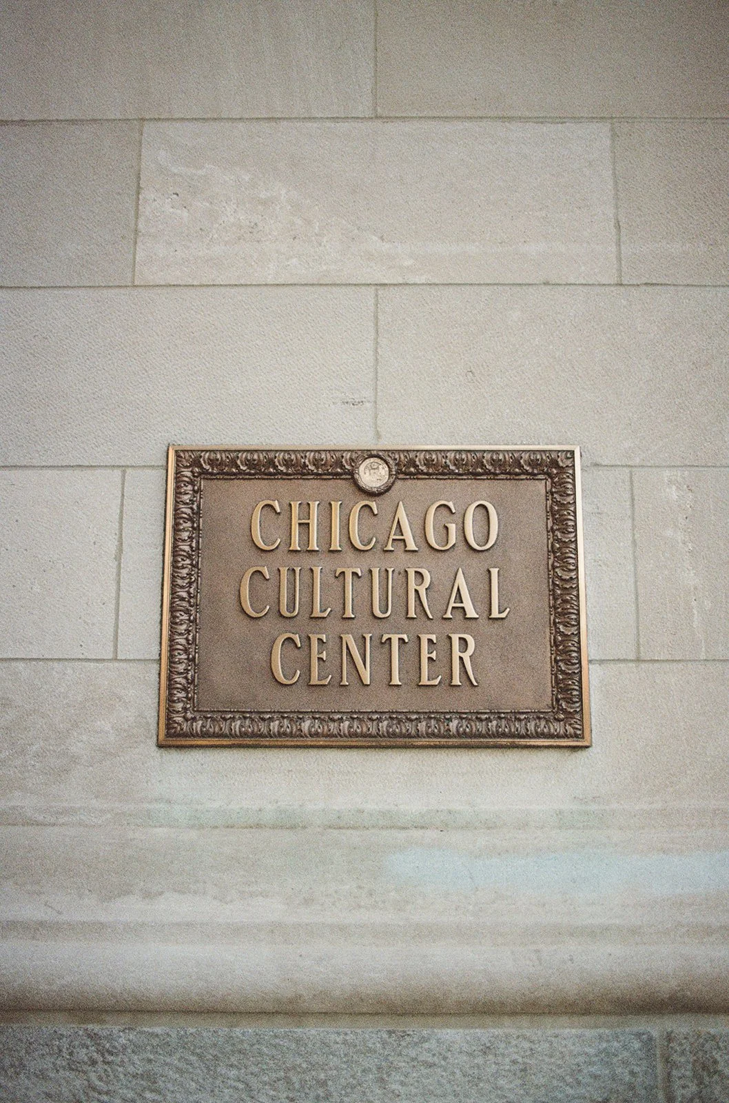 The iconic Chicago Cultural Center exterior plaque, marking this historic and architectural venue. Shot on film by a Chicago wedding photographer.