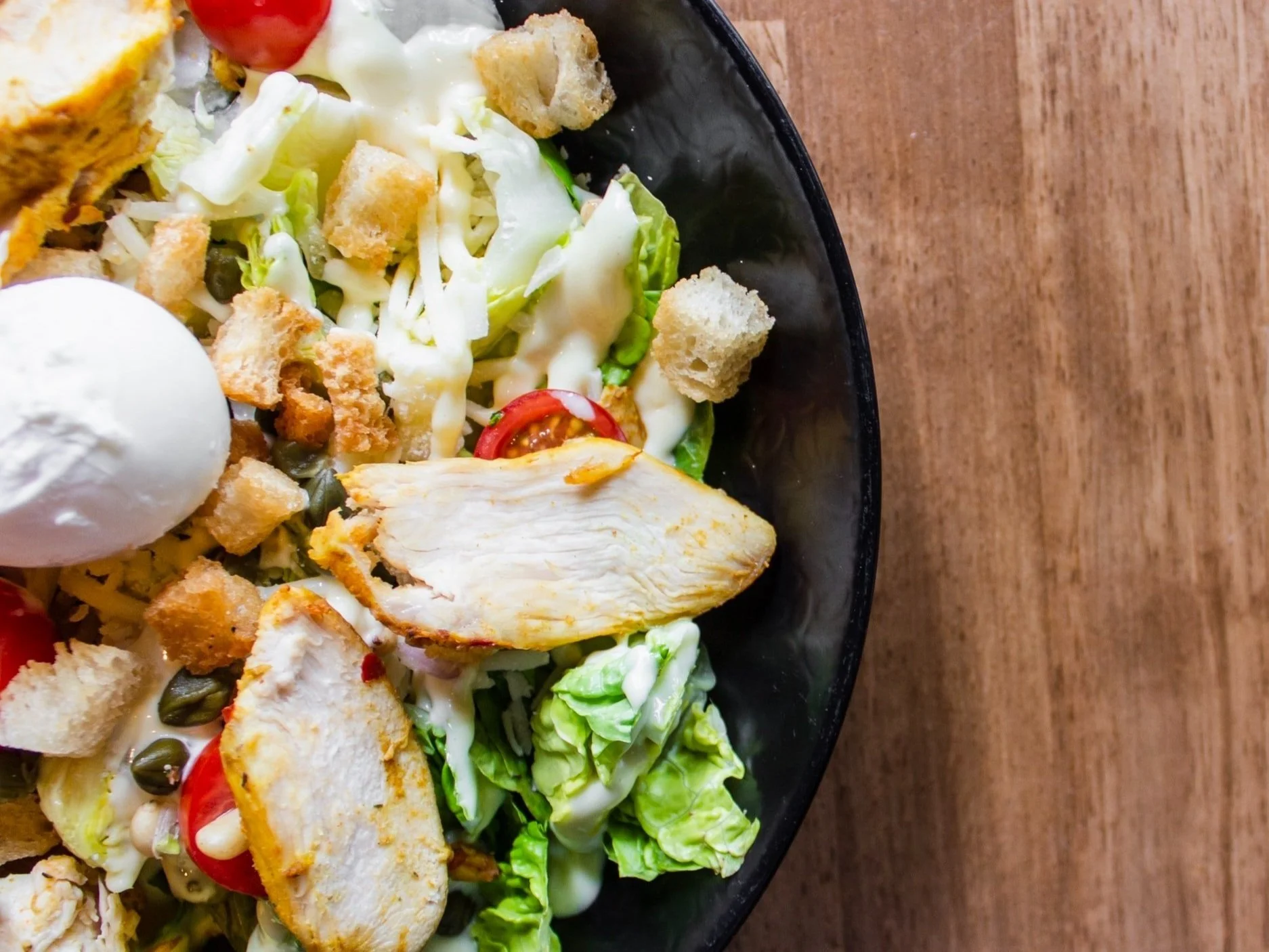 Plate of salad, chicken and egg