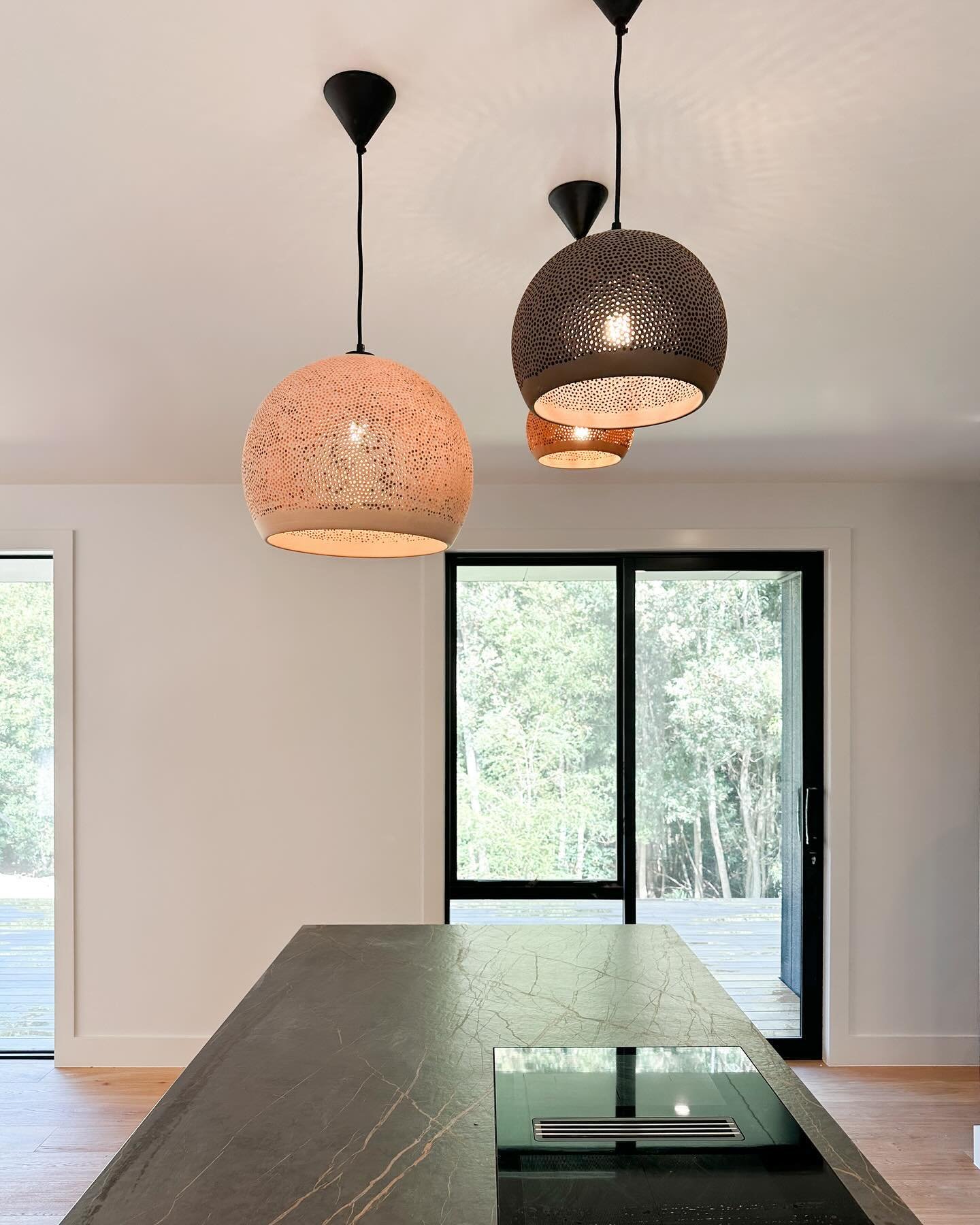 Finishing up the kitchen &amp; scullery with the bench top install and feature lighting ⚡️

This kitchen by @mastercraftnz incorporates clever joinery, hidden features and top of the line appliances. The induction cooktop is centred on the island for