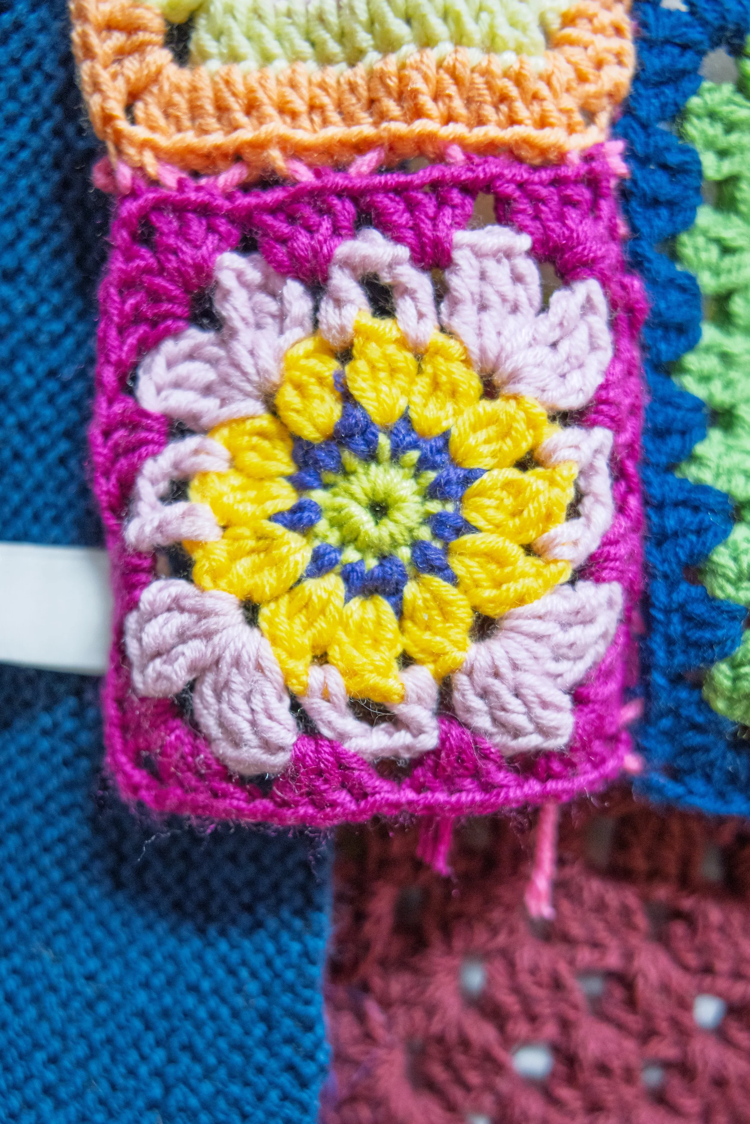 Yellow, pink and purple crocheted square