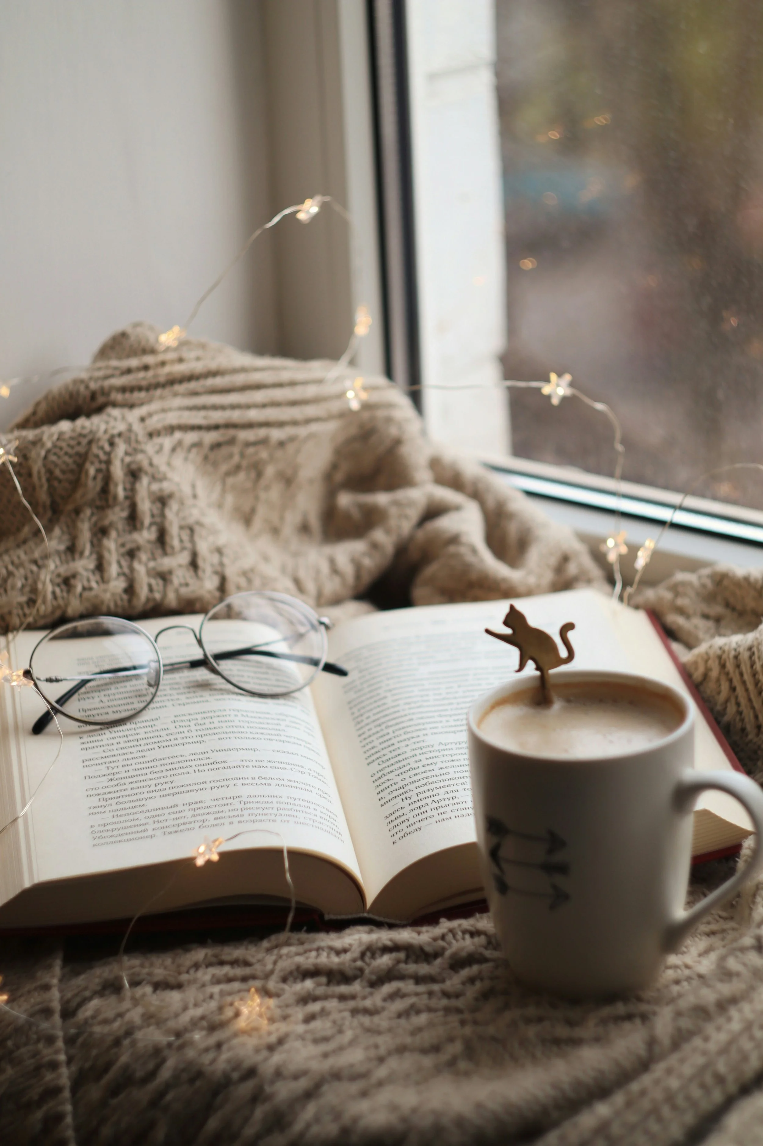 Book with coffee cup and cat motif