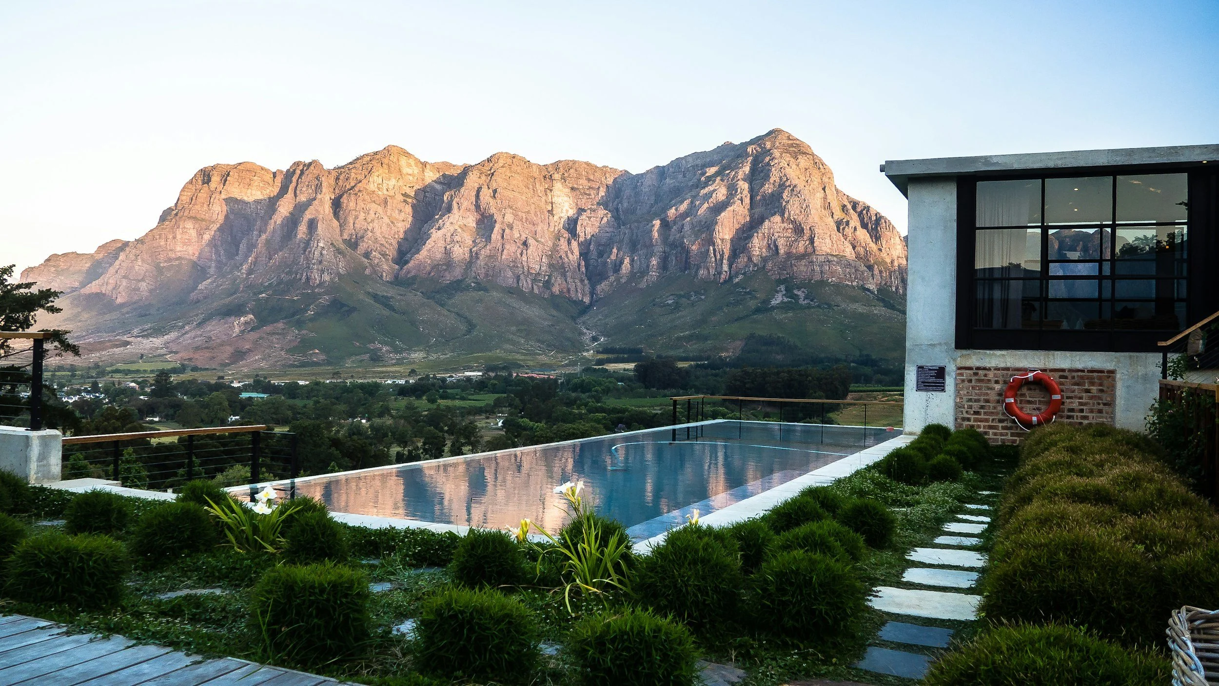 Serene mountain-view infinity pool at a boutique lodge in South Africa’s Winelands.