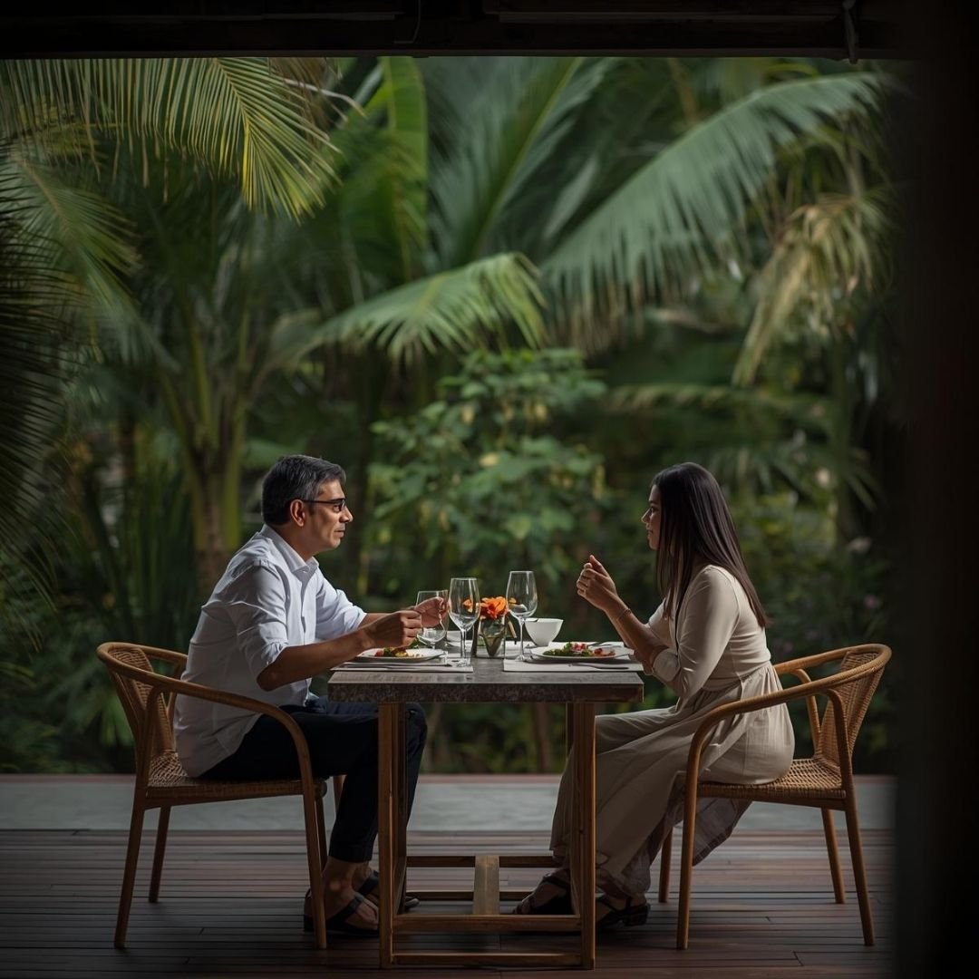 Couple sharing a quiet dinner in a Bali garden setting surrounded by lush greenery and soft natural light