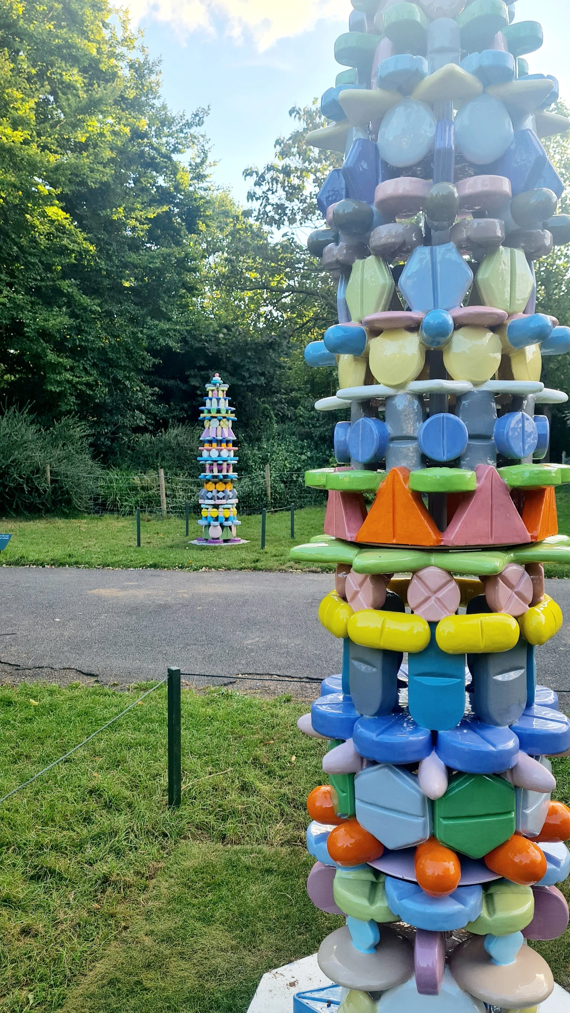 FRIEZE Sculpture in Regent's Park, installation view of "Pillar IV” and “Pillar V”, 2024. Glazed ceramics, metal structure