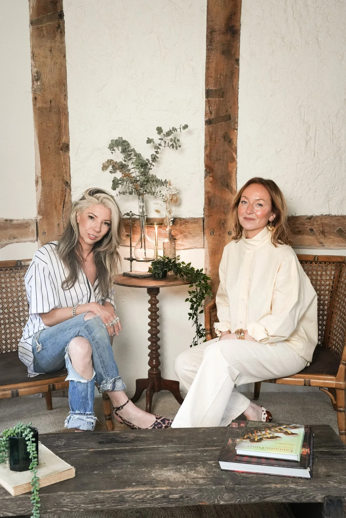 Katie & Susannah, founders of Butchers Salon sat by a small side table