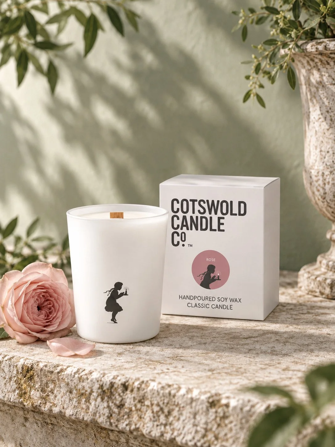 Rose wood wick candle and matching box by Cotswold Candle Co., styled in a home interior with natural light.