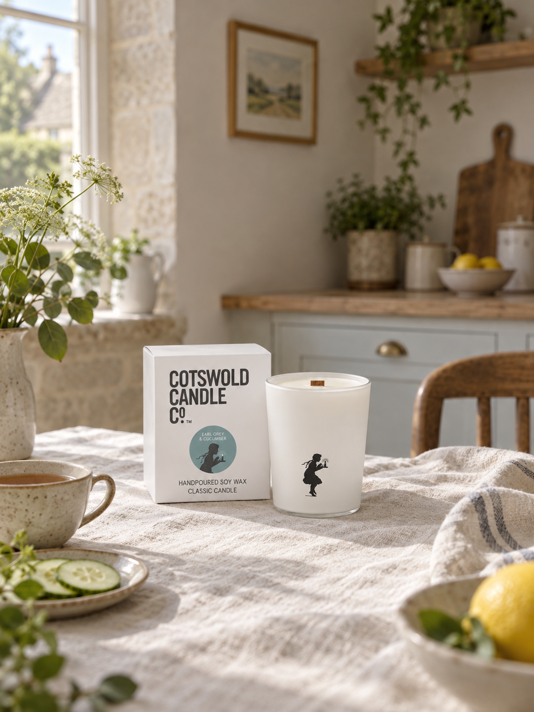 Earl Grey & Cucumber wood wick candle and matching box by Cotswold Candle Co., styled in a home interior with natural light.