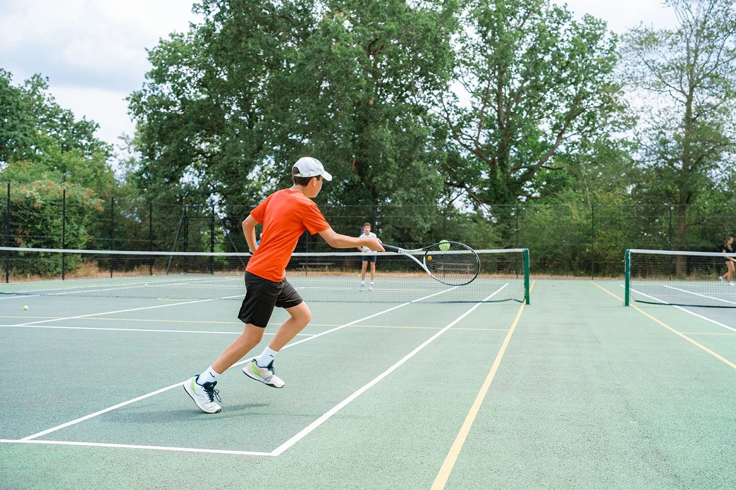 Student in tennis programme at Charterhouse Summer School