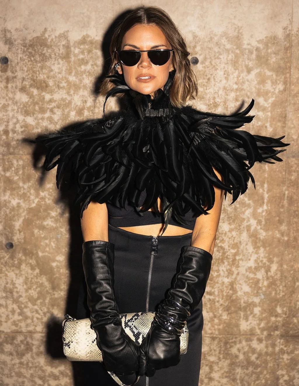 🪶 

hair: @taylorshermanhmua 
makeup: @adrianarnestora 
📷: @katierosebraugh 
fit (skirt, top, sunglasses, bag): @khaite_ny @richeyrich1208 
collar: thrifted 
event: @fgidallas Night of Stars