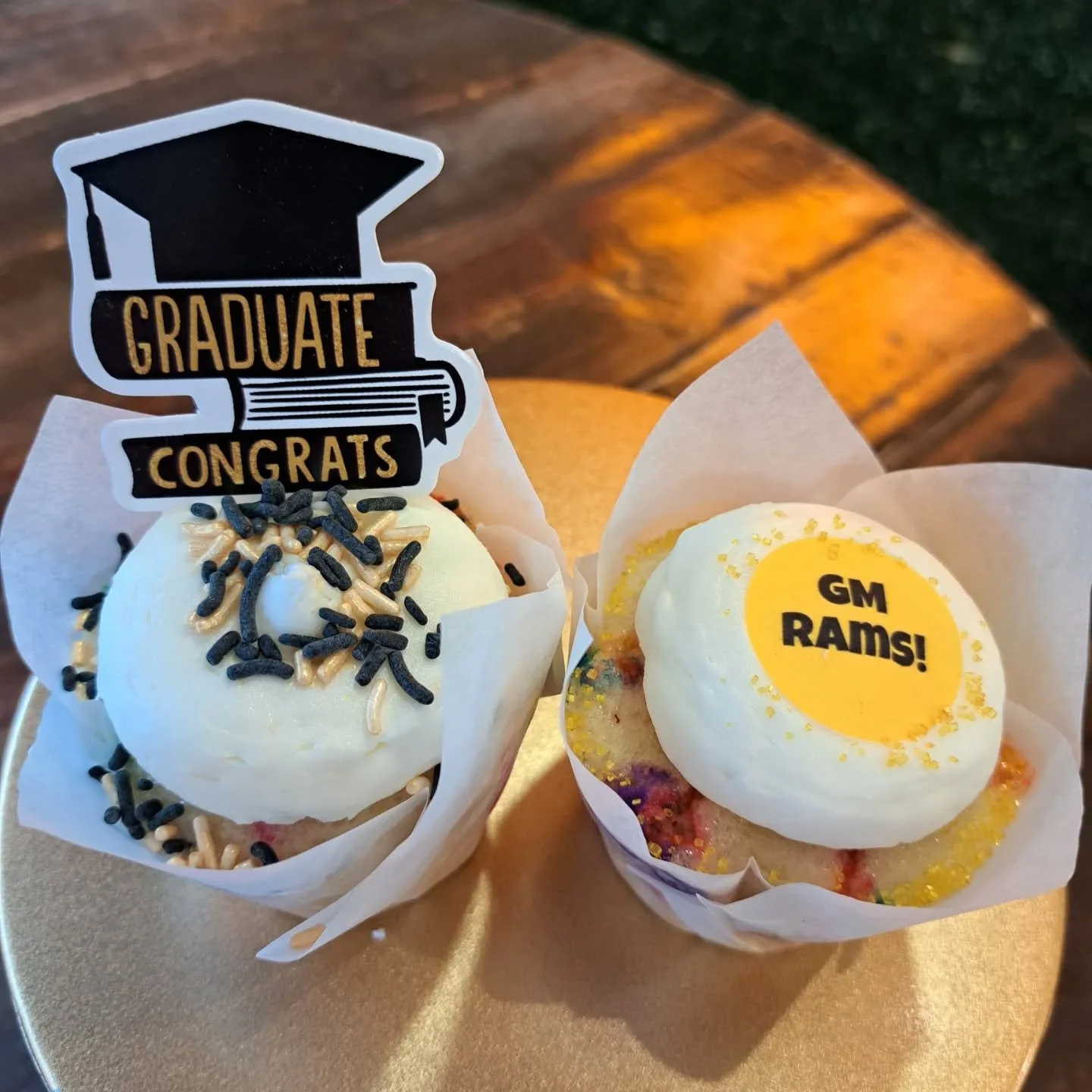 Graduation season is here and we're ready to celebrate the class of 2026! Order your custom cupcakes with school colors, Graduation toppers and new this year....custom edible designs for many local schools!! (Available with advance notice for an extr