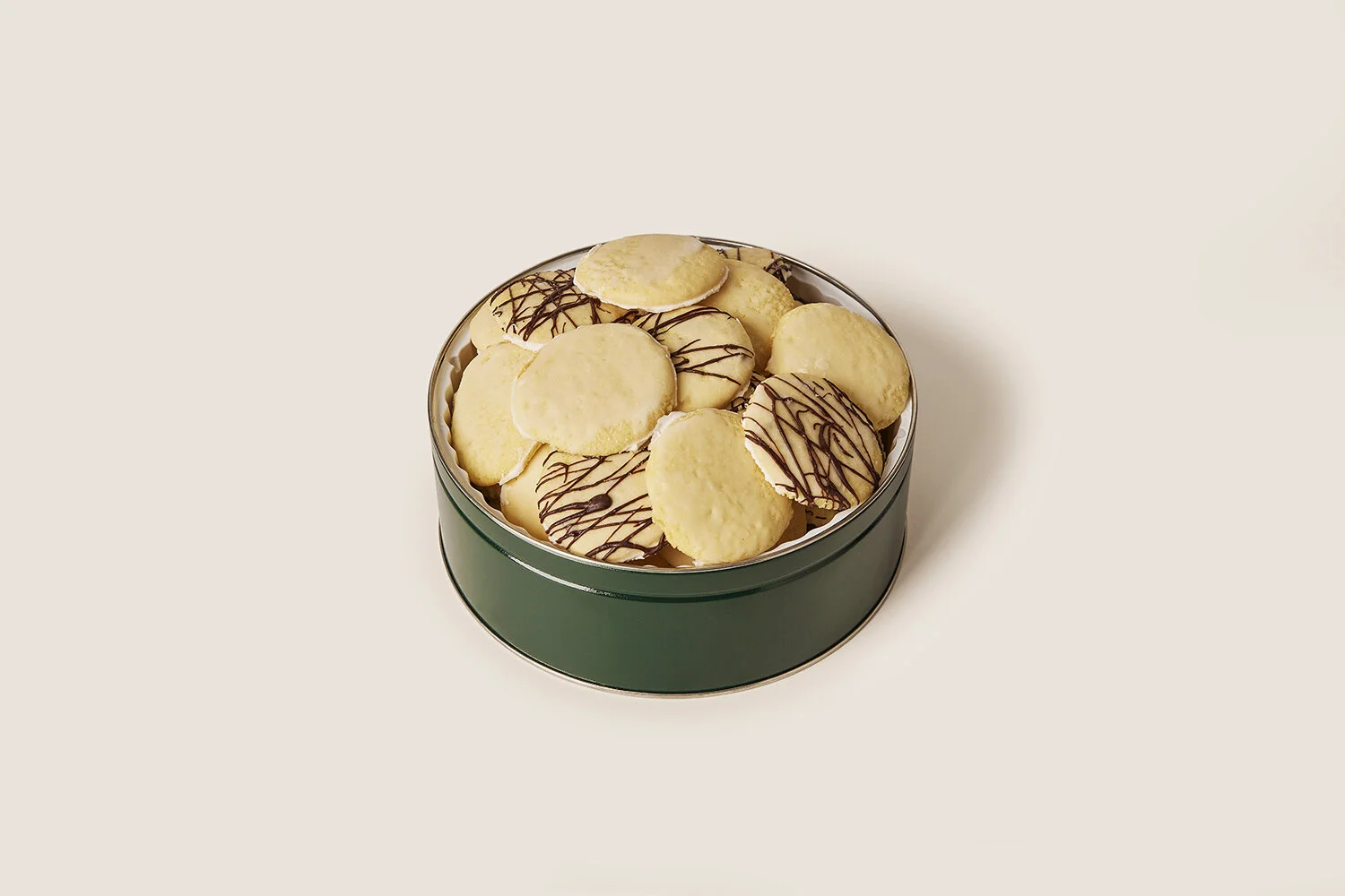 cookie tin filled with chocolate chip and lemon glazed ricotta cookies