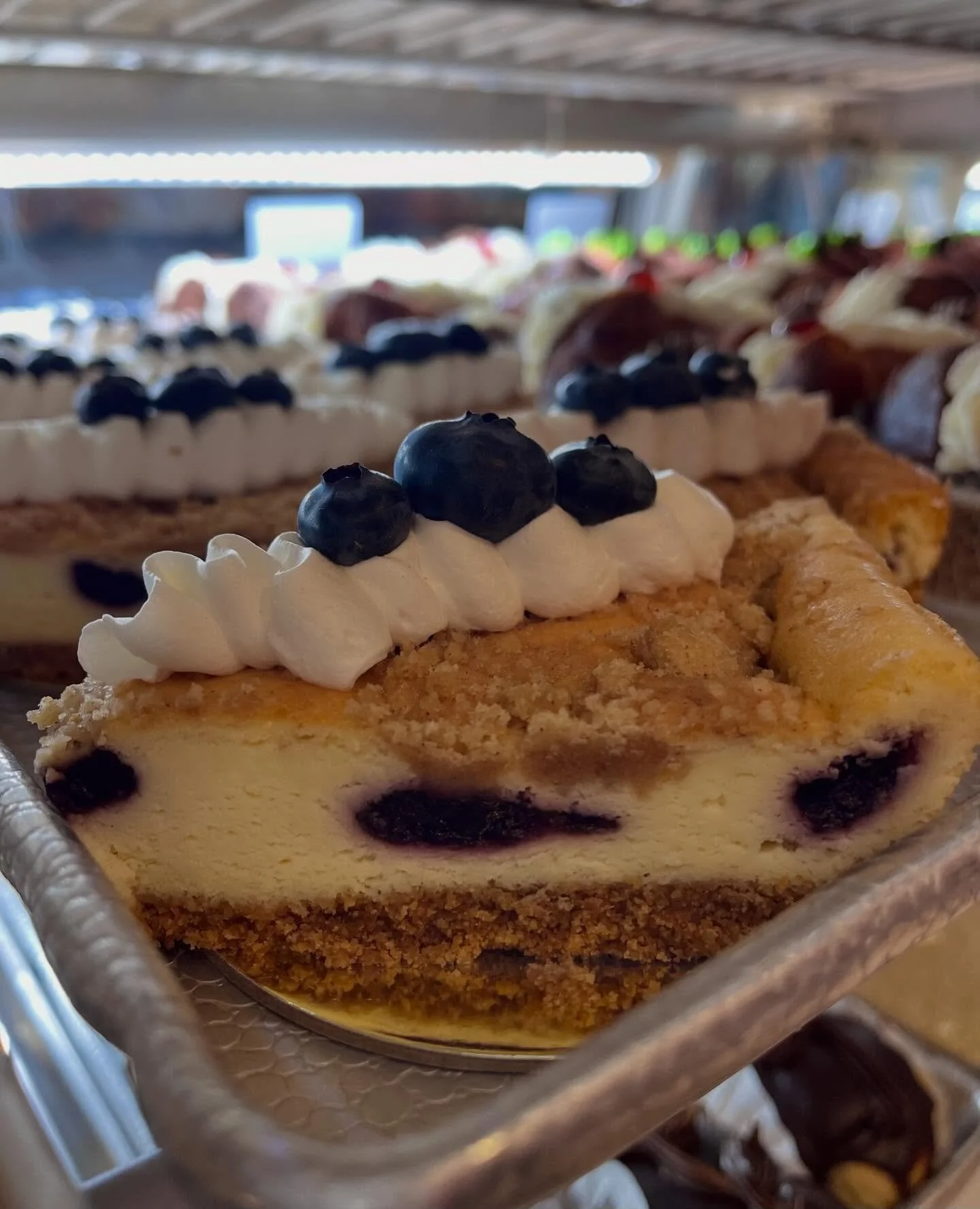 Blueberry New York Cheesecake Bars just hit the case &amp; we&rsquo;re already berry obsessed 🫐 

#limitedtimeonly #blueberrynewyorkcheesecake #blueberrycheesecake #newyorkcheesecake #cheesecakebars