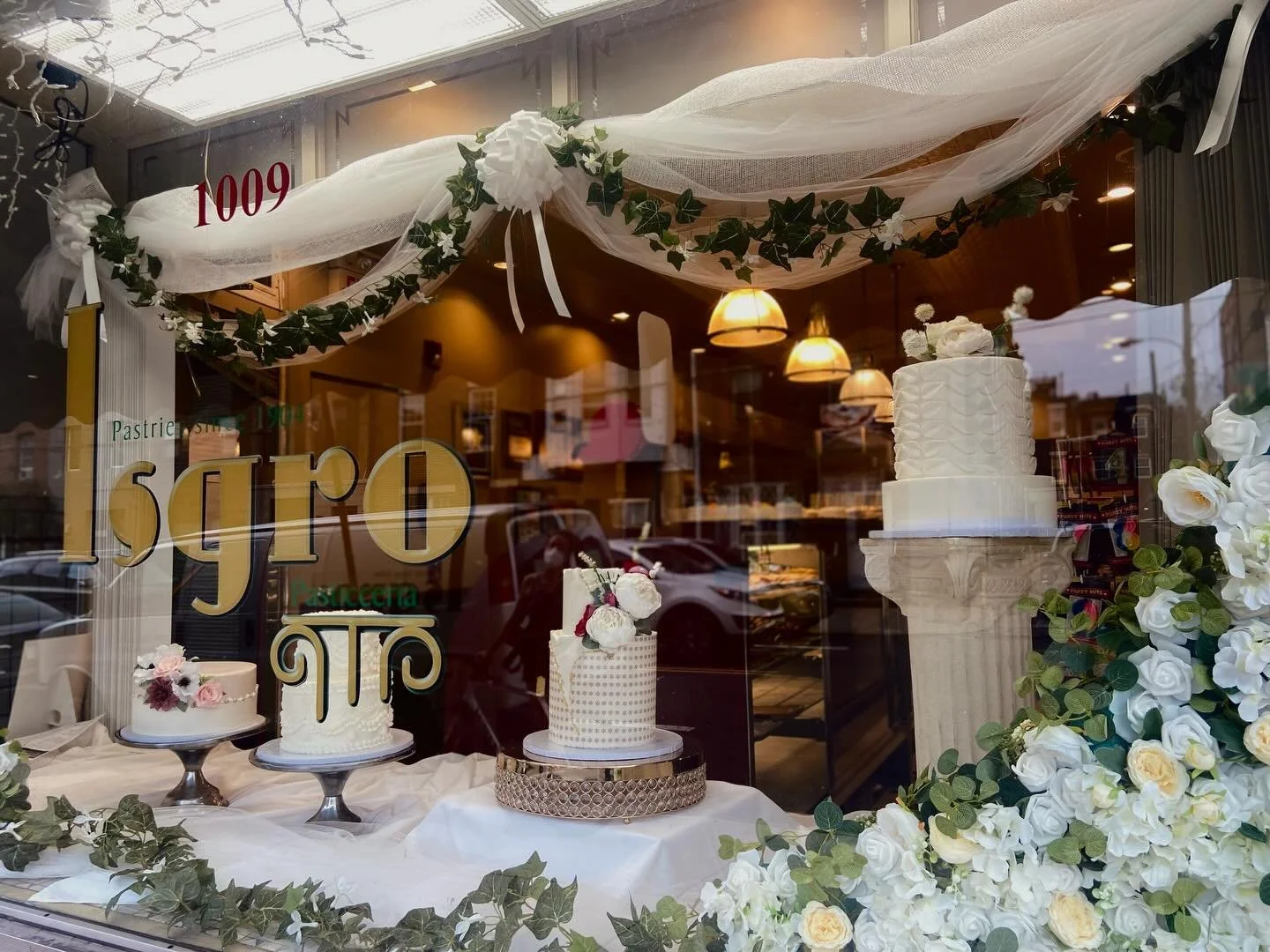 Wedding season has us digging through the archives. Five years ago, even our storefront was dressed for the occasion 💍🍰🍾💌

#weddingseason #weddingcakes #weddingcake #since1904 #bakerywindow